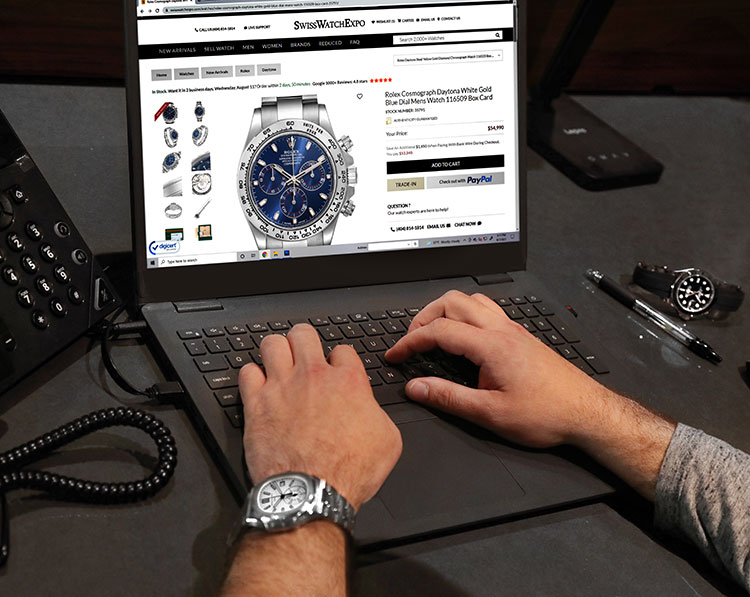 Photo of blue Rolex Cosmograph watch on screen