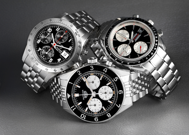 Stainless steel chronograph watches: Tudor Tiger Prince, Omega Speedmaster, and TAG Heuer Autavia