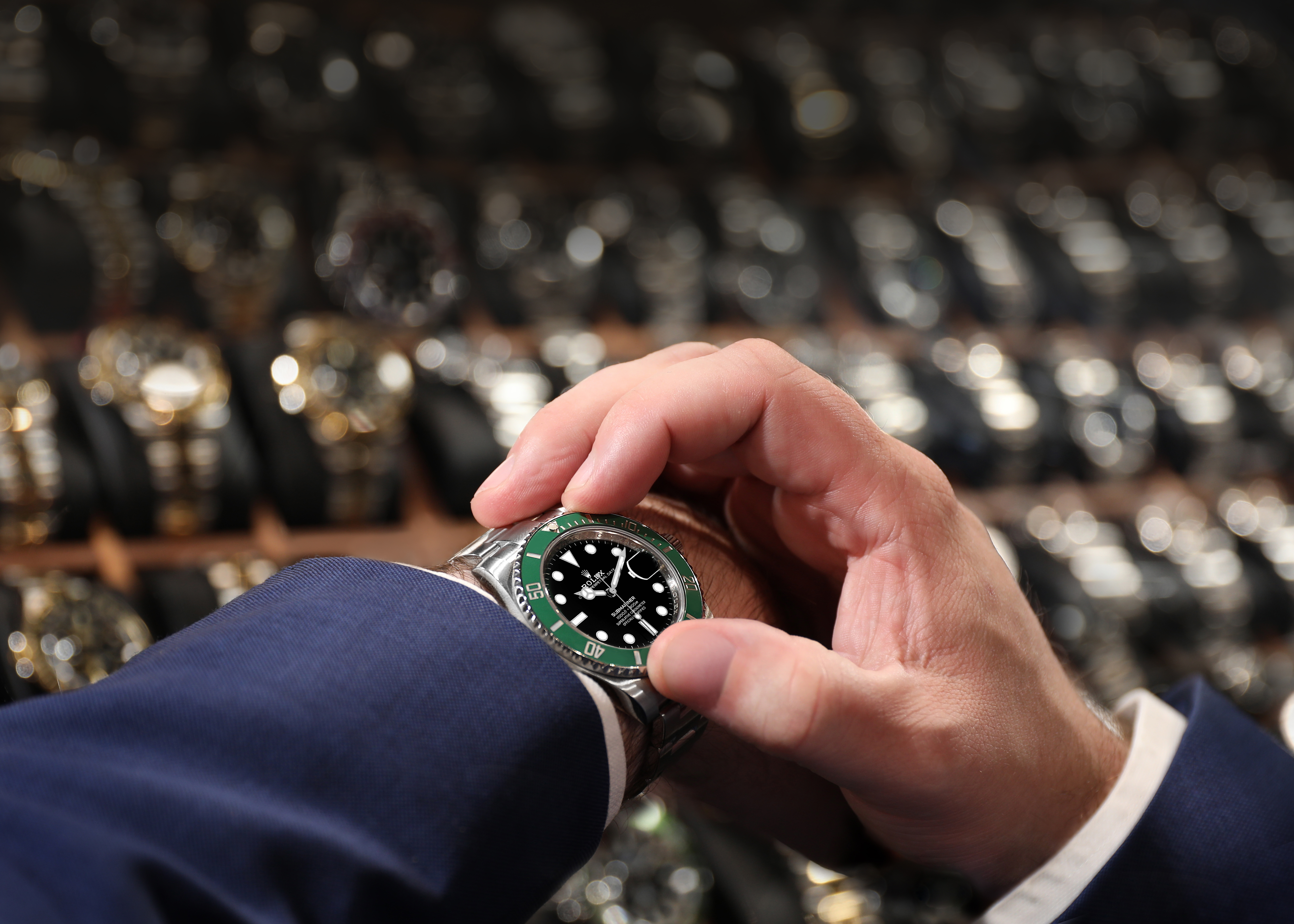 Client buying Rolex Kermit on the pre-owned watch market