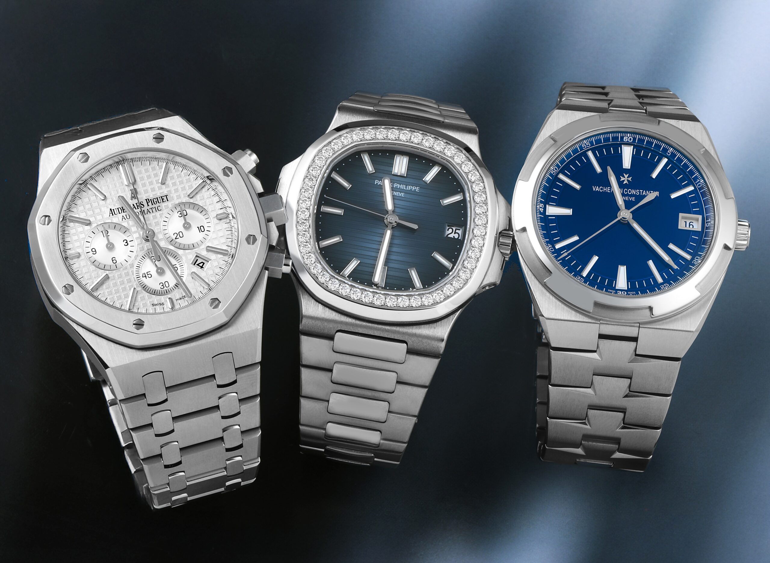 The Holy Trinity of Watches featuring an Audemars Piguet Royal Oak Chronograph, Patek Philippe Nautilus with diamond bezel, and Vacheron Constantin Overseas.