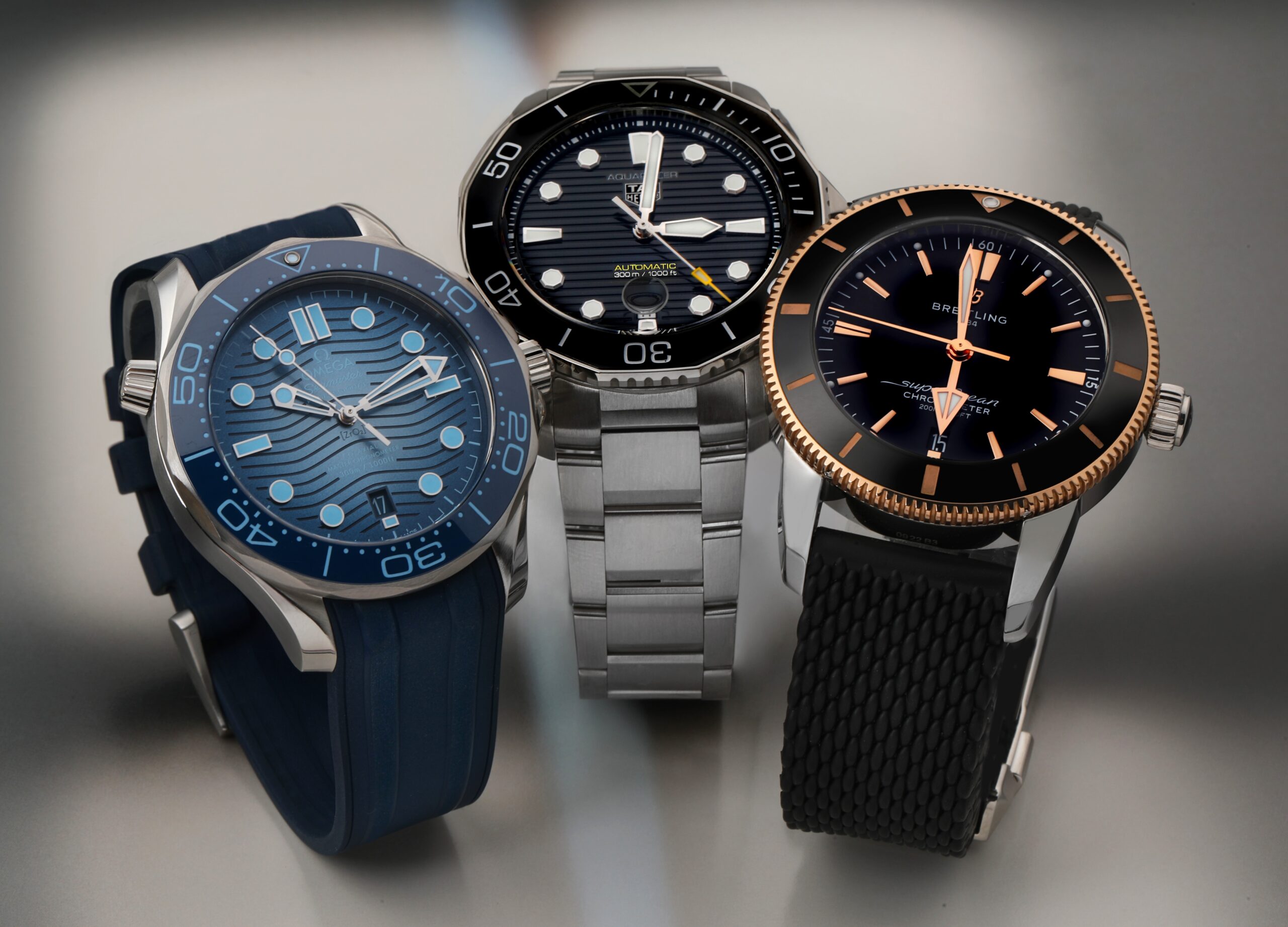Best Dive Watches Under 5000 USD for 2025 - Omega Seamaster, TAG Heuer Aquaracer, Breitling Superocean