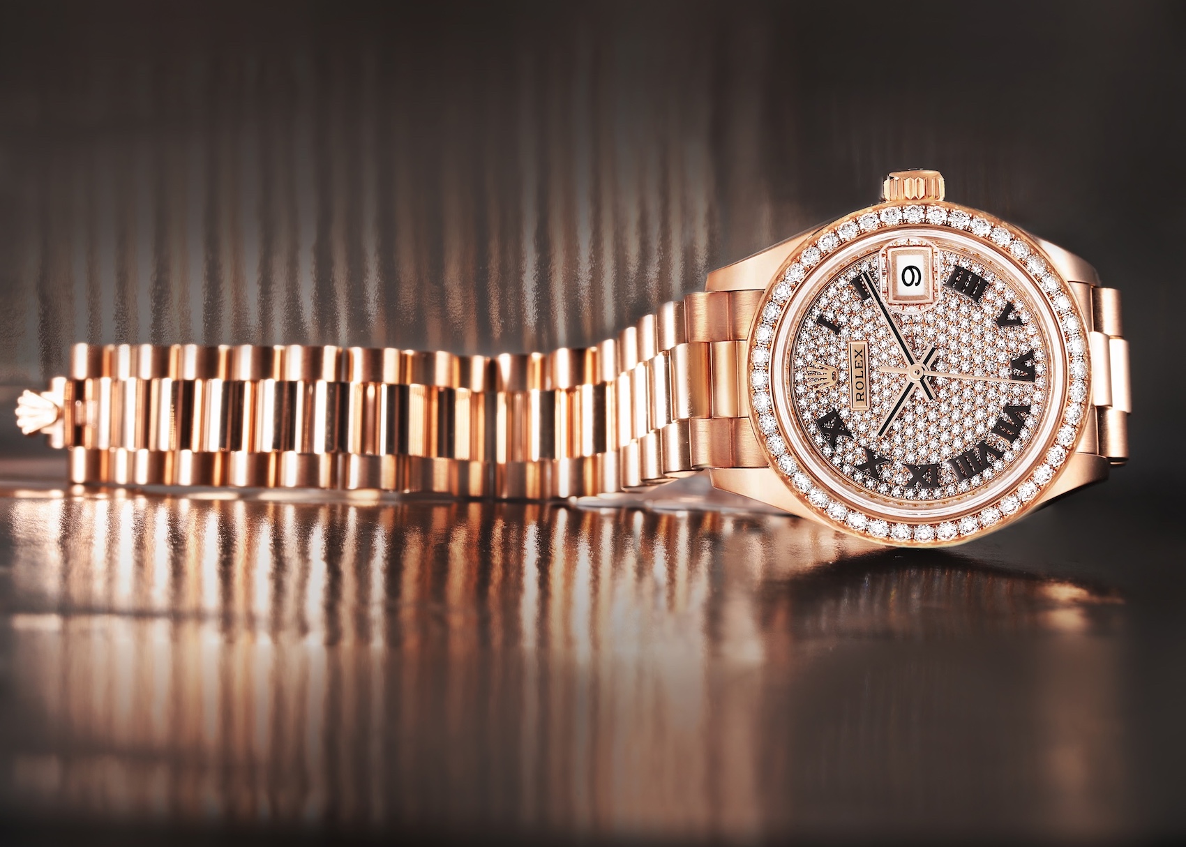 Close-up of a Rolex President 28 Ladies Watch (model 279135) in rose gold, featuring a pavé diamond dial, diamond-set bezel, and a President bracelet.