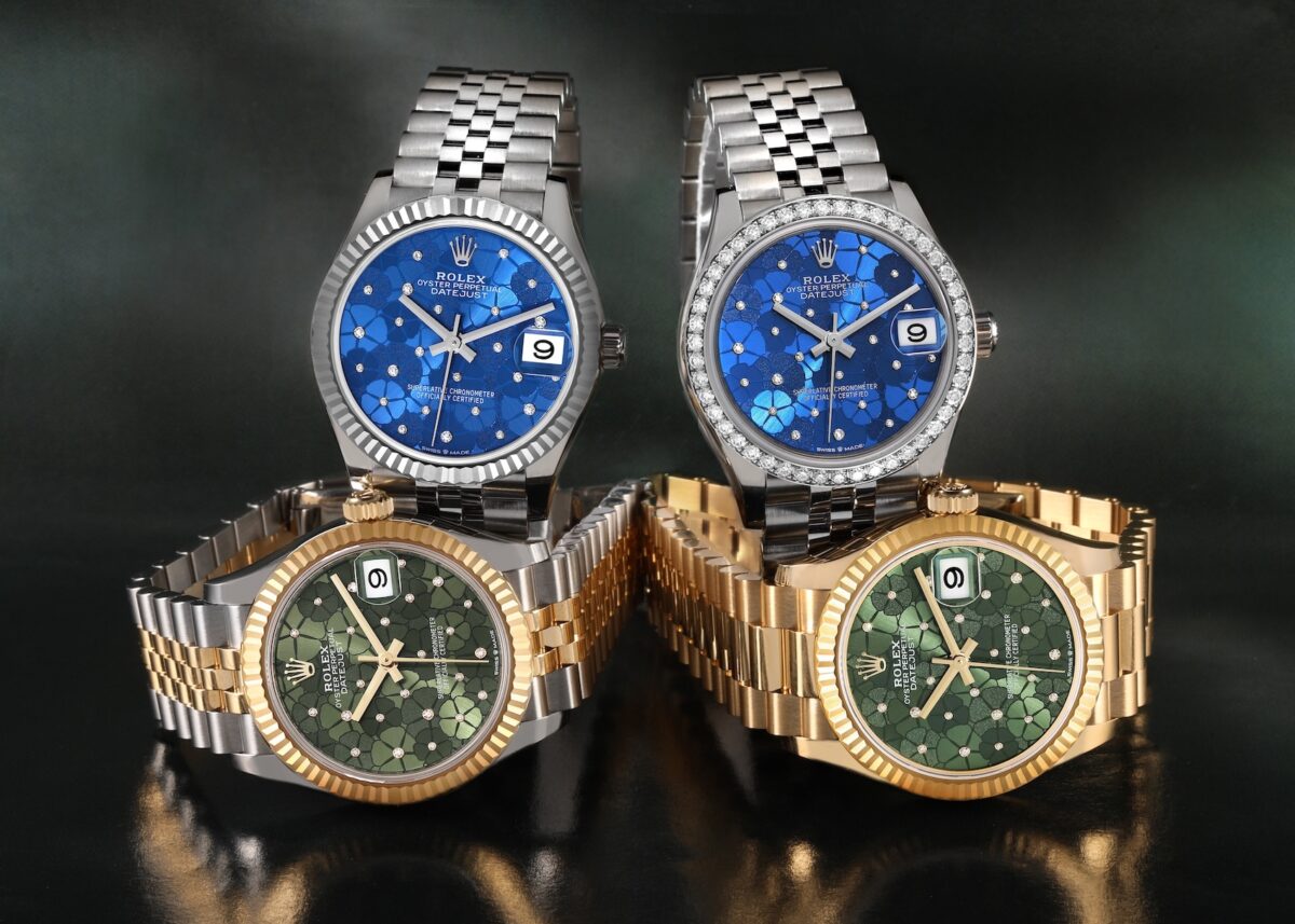 Four luxury Rolex Datejust watches: two blue-dialed steel models (one with diamond bezel), and two green-dialed gold/two-tone models, all featuring floral patterns on their dials.