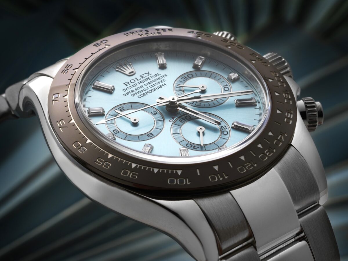Close-up of a Platinum Rolex Cosmograph Daytona with an ice-blue dial and brown Cerachrom bezel, showcasing the chronograph sub-dials.