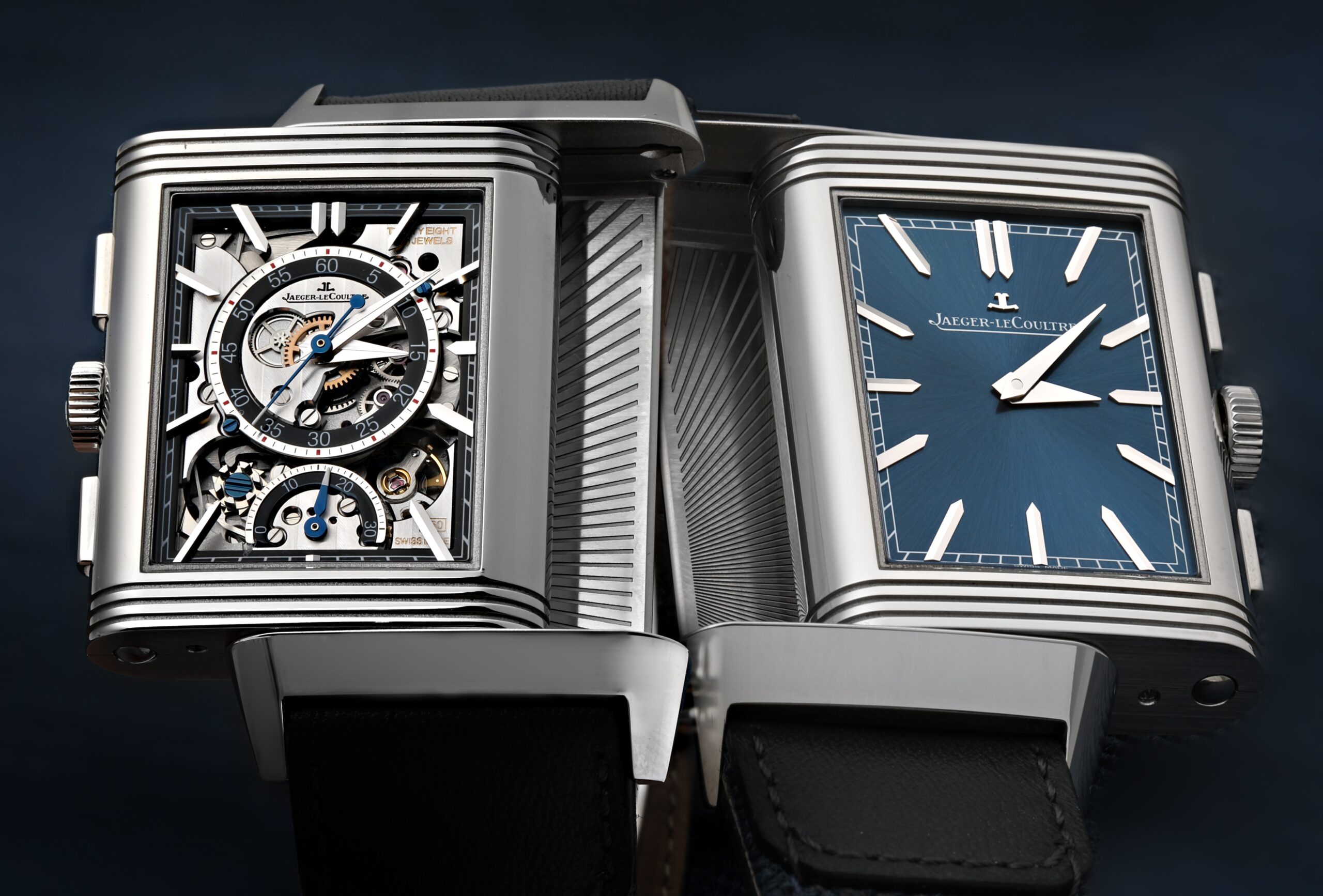 A Jaeger-LeCoultre Reverso Tribute Chronograph shown with its case swiveled, displaying both the classic blue dial and the intricate skeletonized chronograph dial.