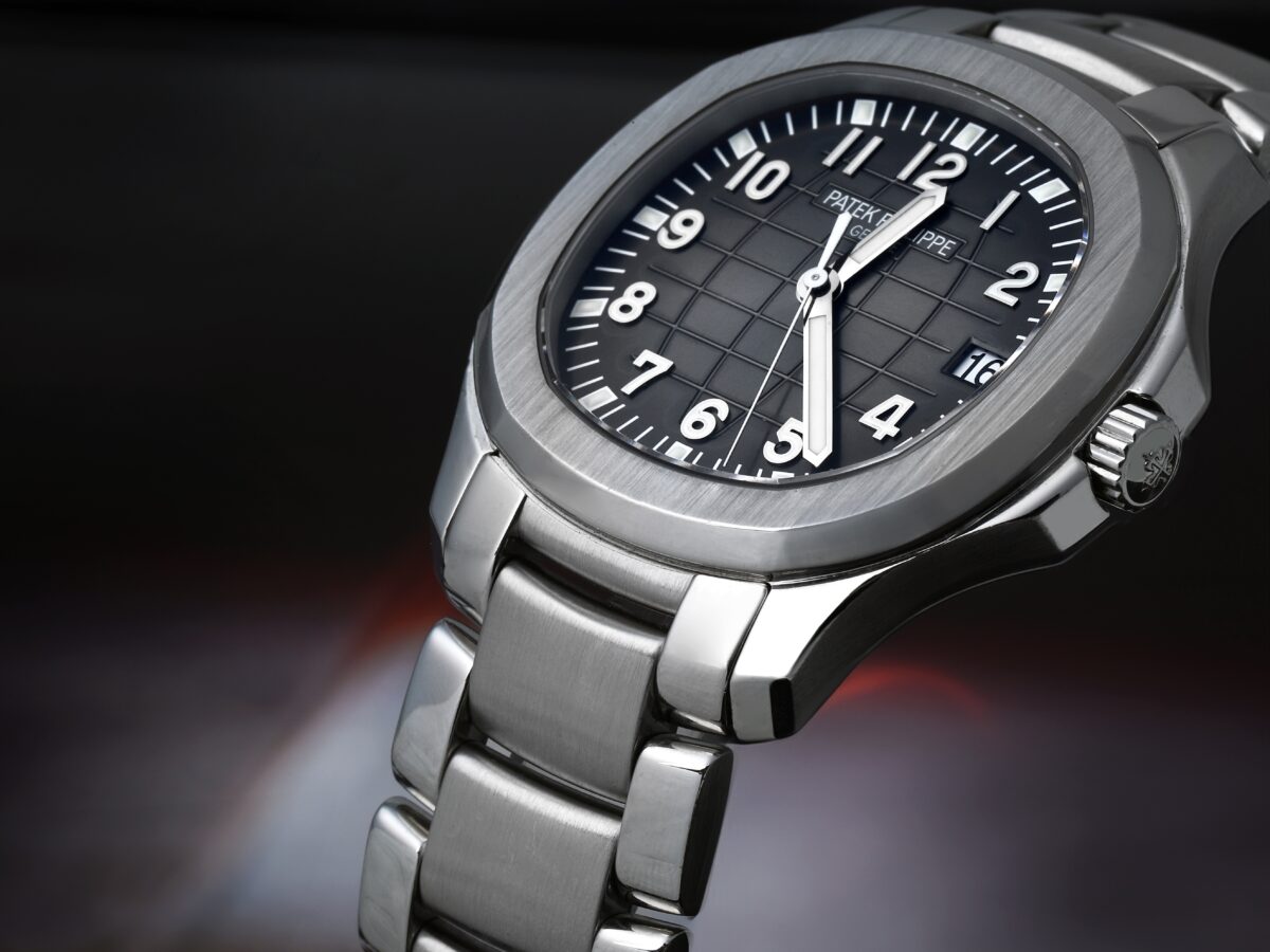 An angled close-up of the Patek Philippe Aquanaut 5167/1A, focusing on its signature rounded octagonal bezel and stainless steel case.