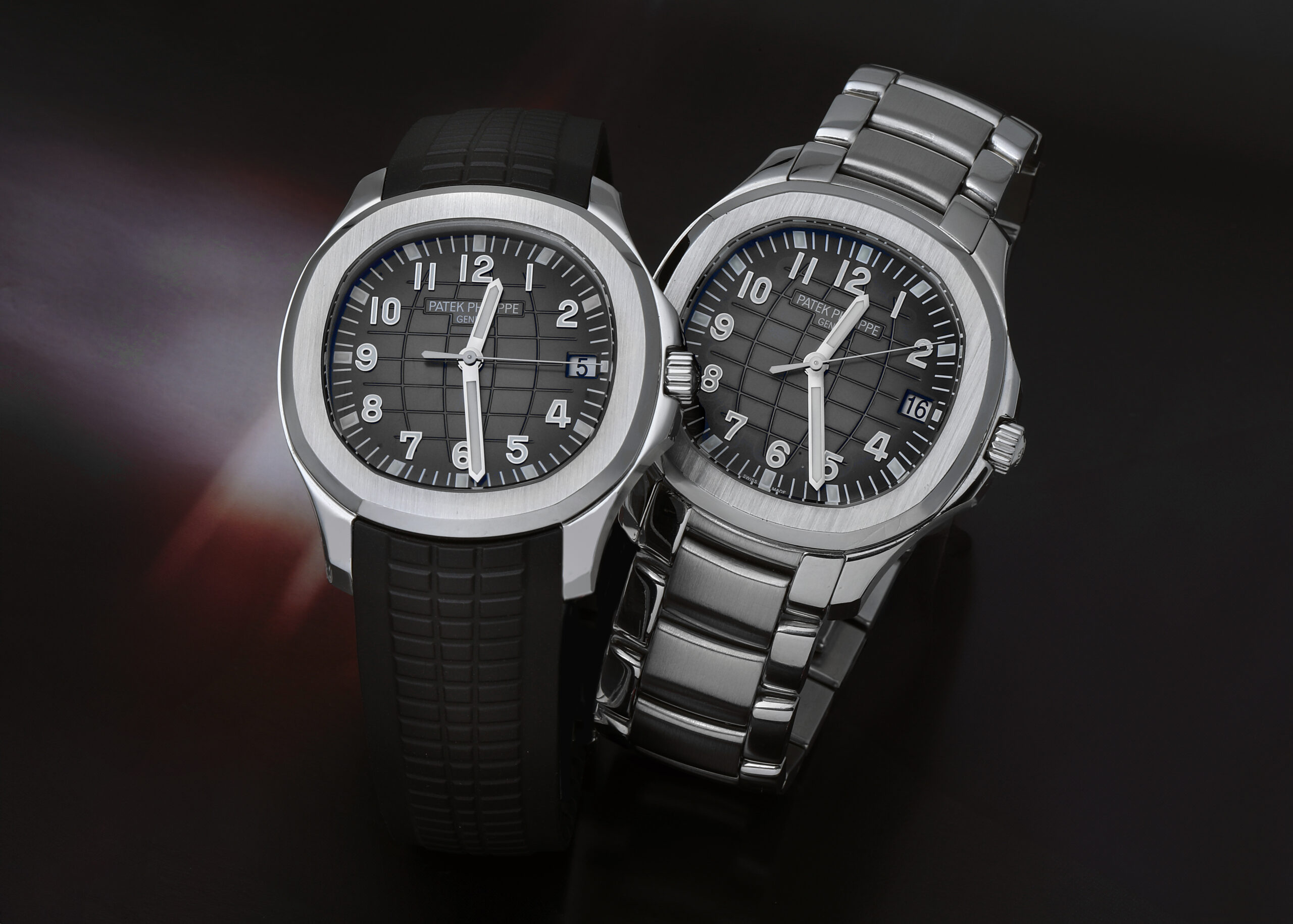 Side-by-side comparison of the Patek Philippe Aquanaut 5167A on a black rubber strap and the now-discontinued 5167/1A on a stainless steel bracelet.
