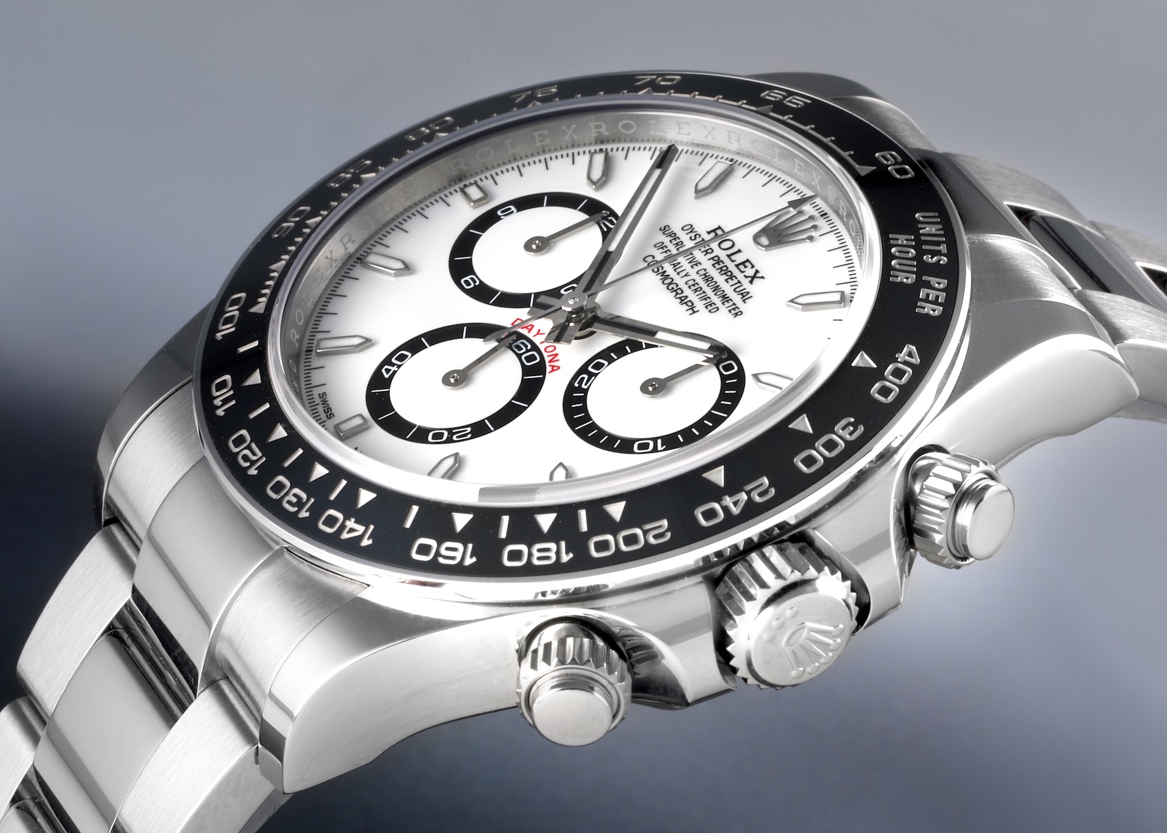 A close-up shot of a Rolex Daytona Ceramic Bezel White Panda Steel Men's Watch 126500, showcasing its white dial with black subdials, ceramic bezel, and stainless steel bracelet.