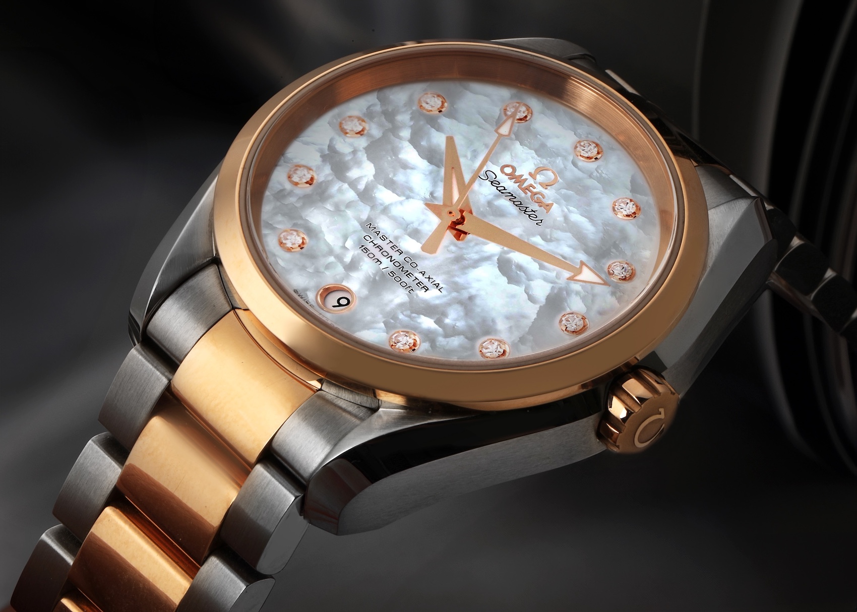 The Omega Seamaster Aqua Terra for ladies in steel and rose gold, with a lustrous white mother-of-pearl dial, diamond hour markers, and a two-tone bracelet.