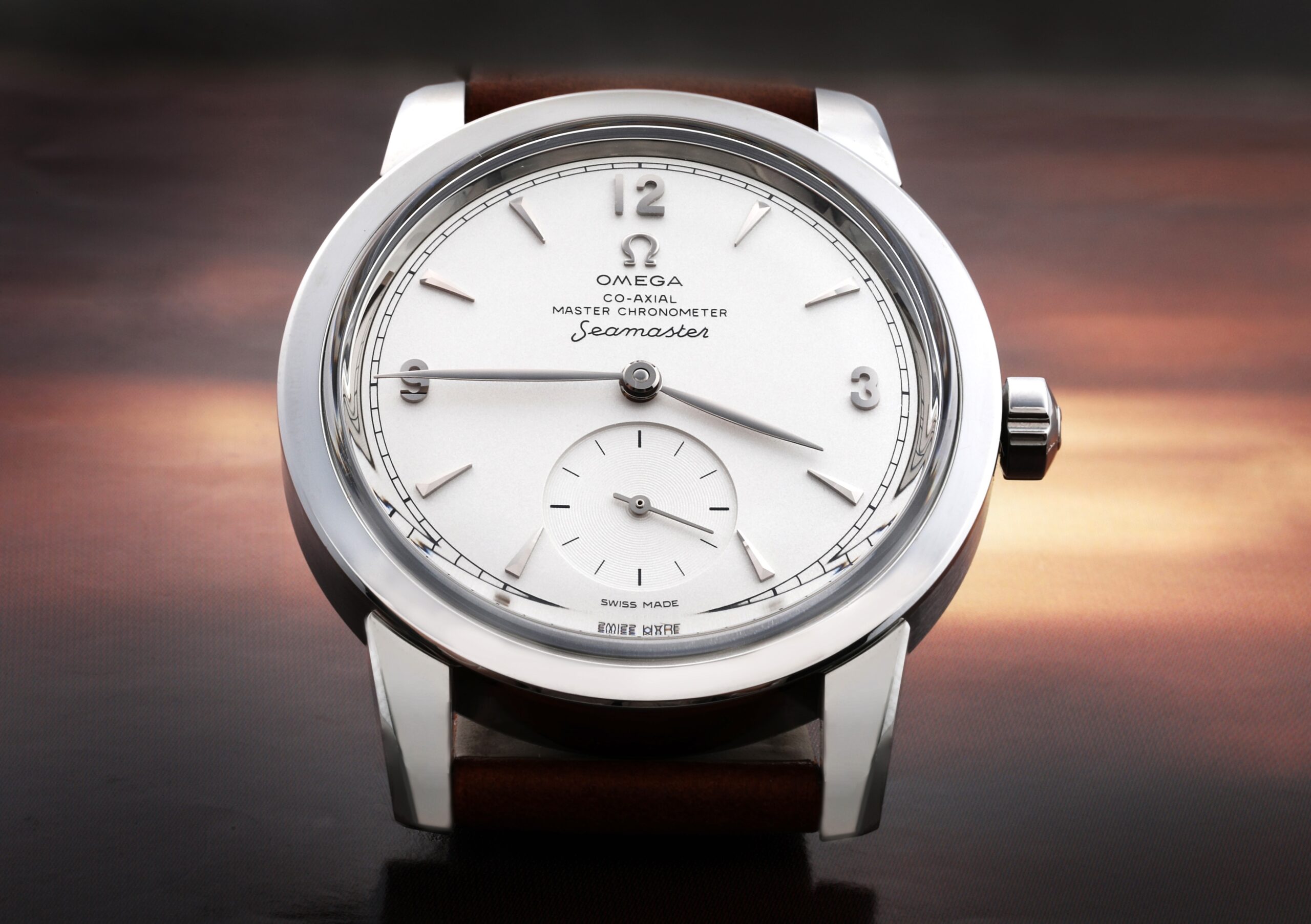 A front-on view of the OMEGA Seamaster 1948 heritage watch, showing its silver dial, small seconds sub-dial, and elegant polished steel case.