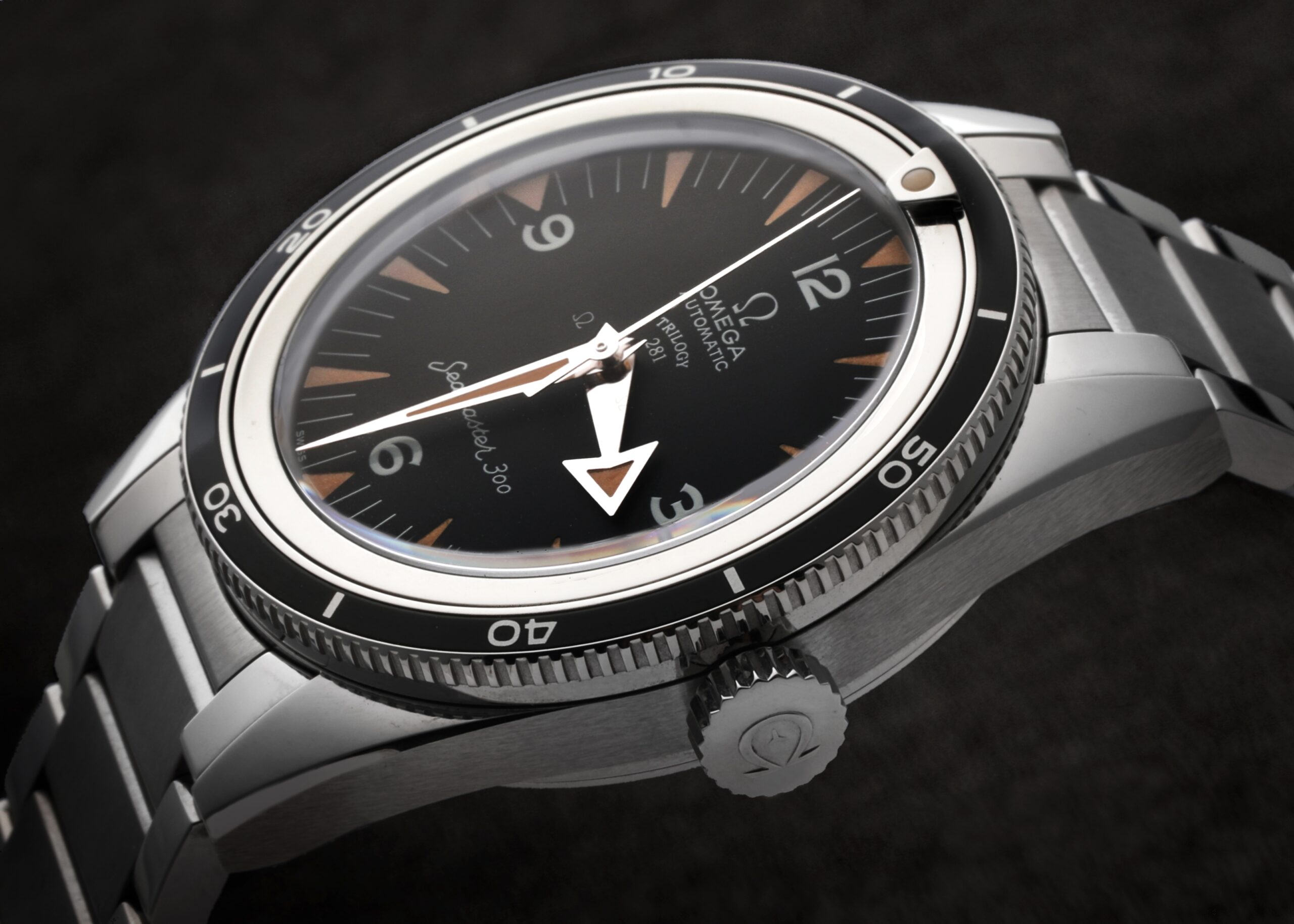 The OMEGA Seamaster 300 heritage model, featuring a black dial with vintage-style markers, broad arrow hands, and a polished steel bezel.