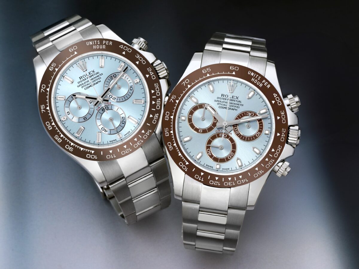 Two Rolex Cosmograph Daytona watches in platinum, featuring ice blue dials and brown ceramic bezels.