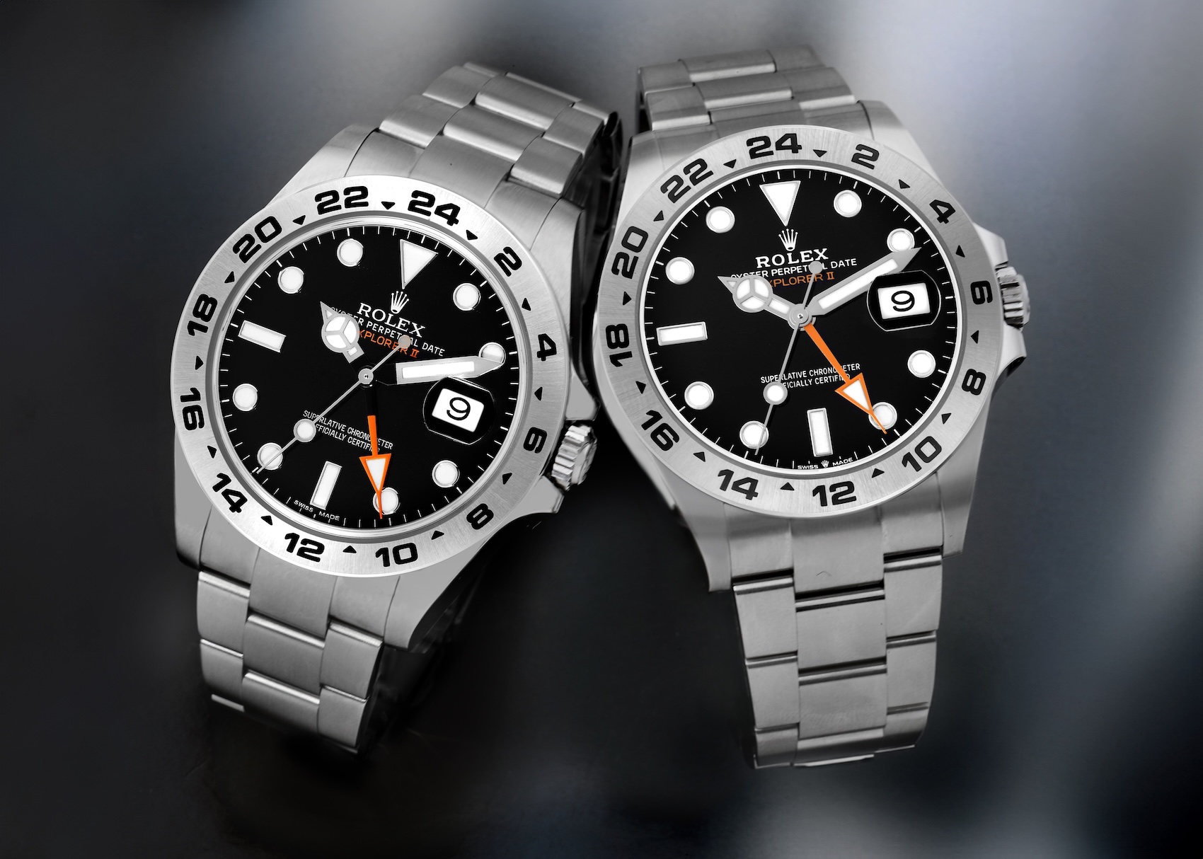 A side-by-side comparison of two Rolex Explorer II models, the 216570 and the newer 226570, both with black dials and stainless steel Oyster bracelets.