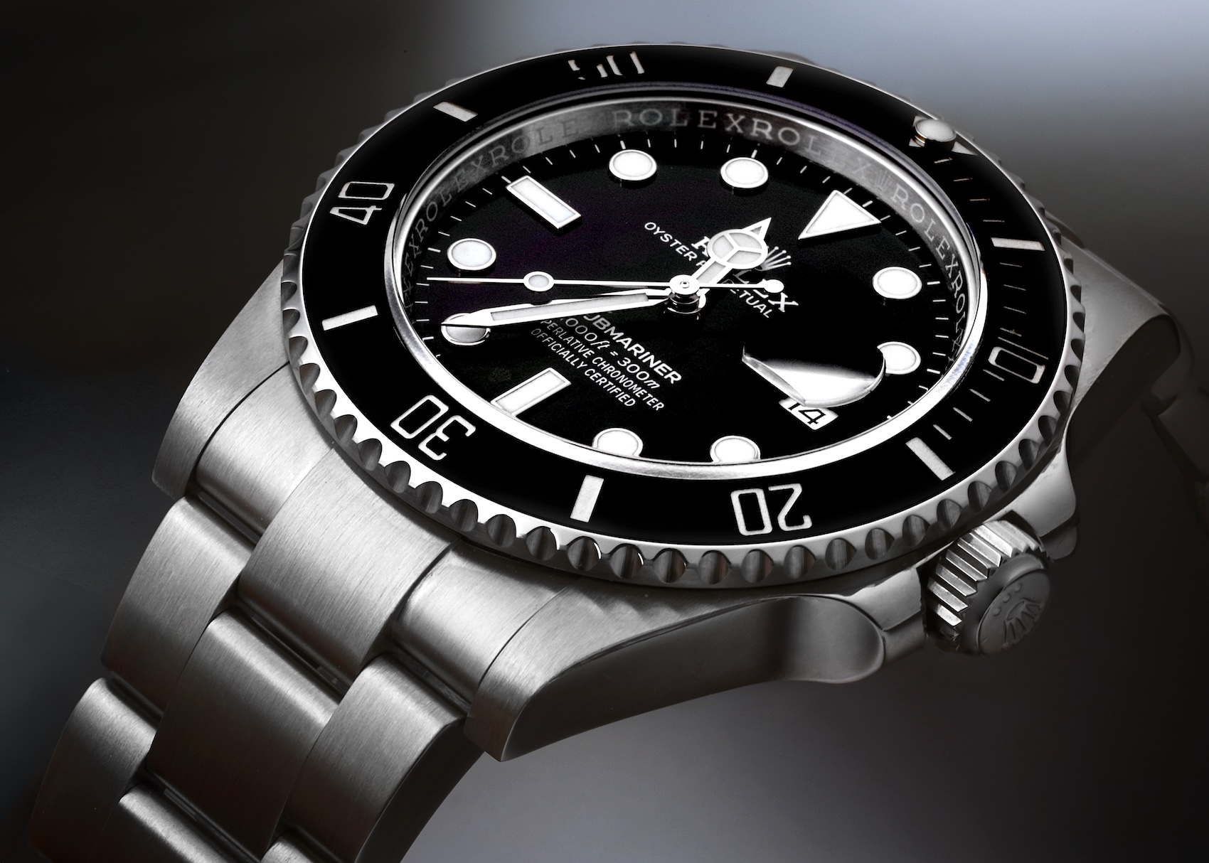 An angled studio photograph of the Rolex Submariner Date 126610, showing its black dial, gleaming ceramic bezel, and brushed stainless steel Oyster bracelet.