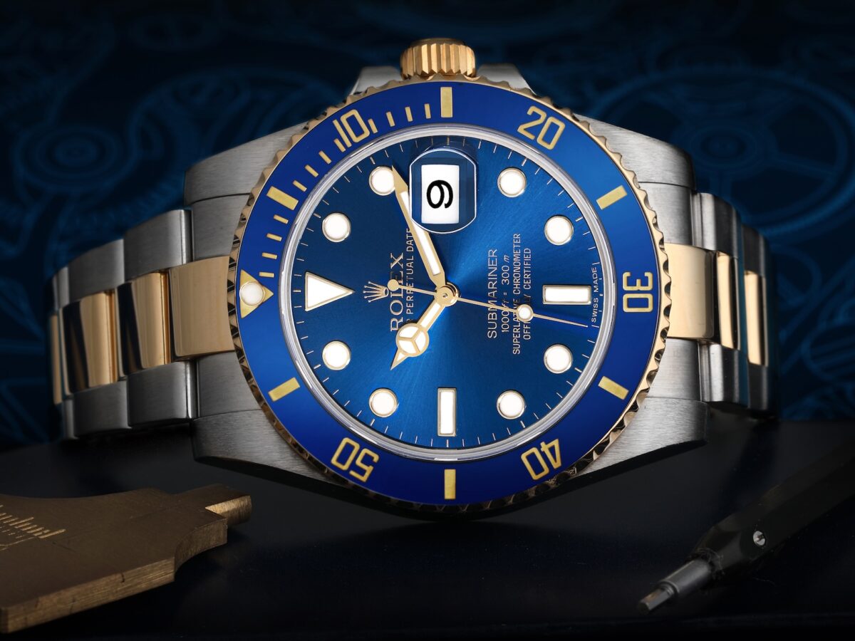 A front-facing shot of the two-tone Rolex Submariner Date 116613LB, nicknamed the "Bluesy," with its blue sunburst dial and yellow gold accents.