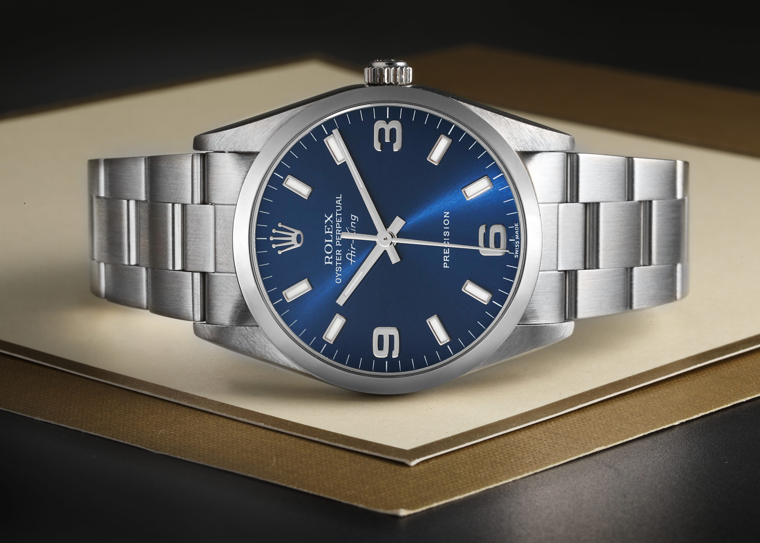 A Rolex Air-King 14000 with a blue 3-6-9 dial, representing one of the most affordable pre-owned Rolex watches for men.