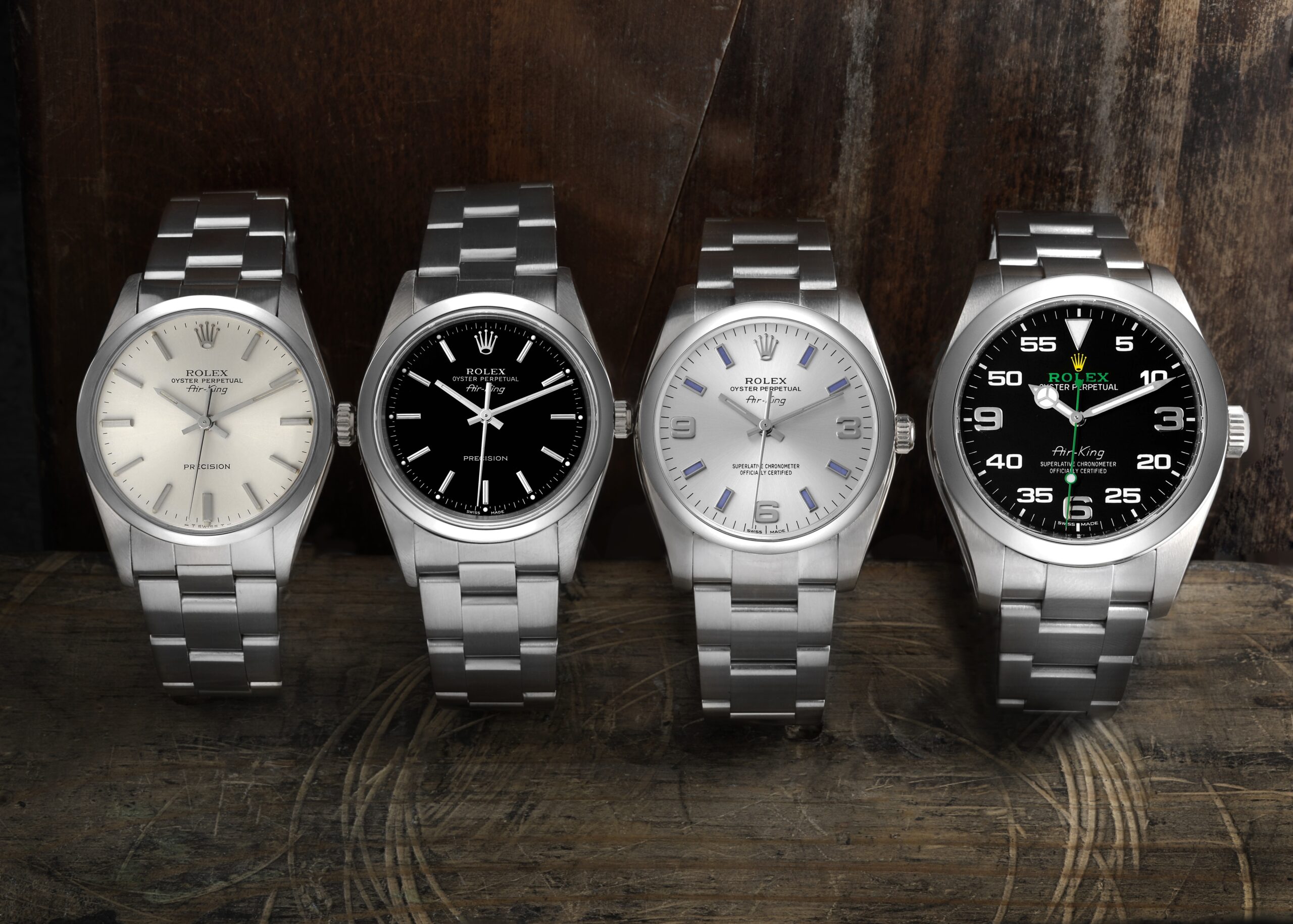 Four Rolex Oyster Perpetual and Air-King watches in stainless steel with various dial colors.