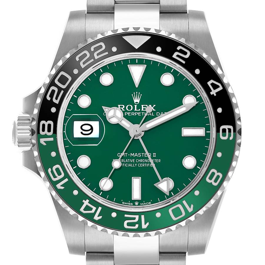 A detailed macro shot of the Rolex GMT-Master II 126729VTNR, showing its vibrant green dial, luminous hour markers, and the signature green and black Cerachrom bezel.