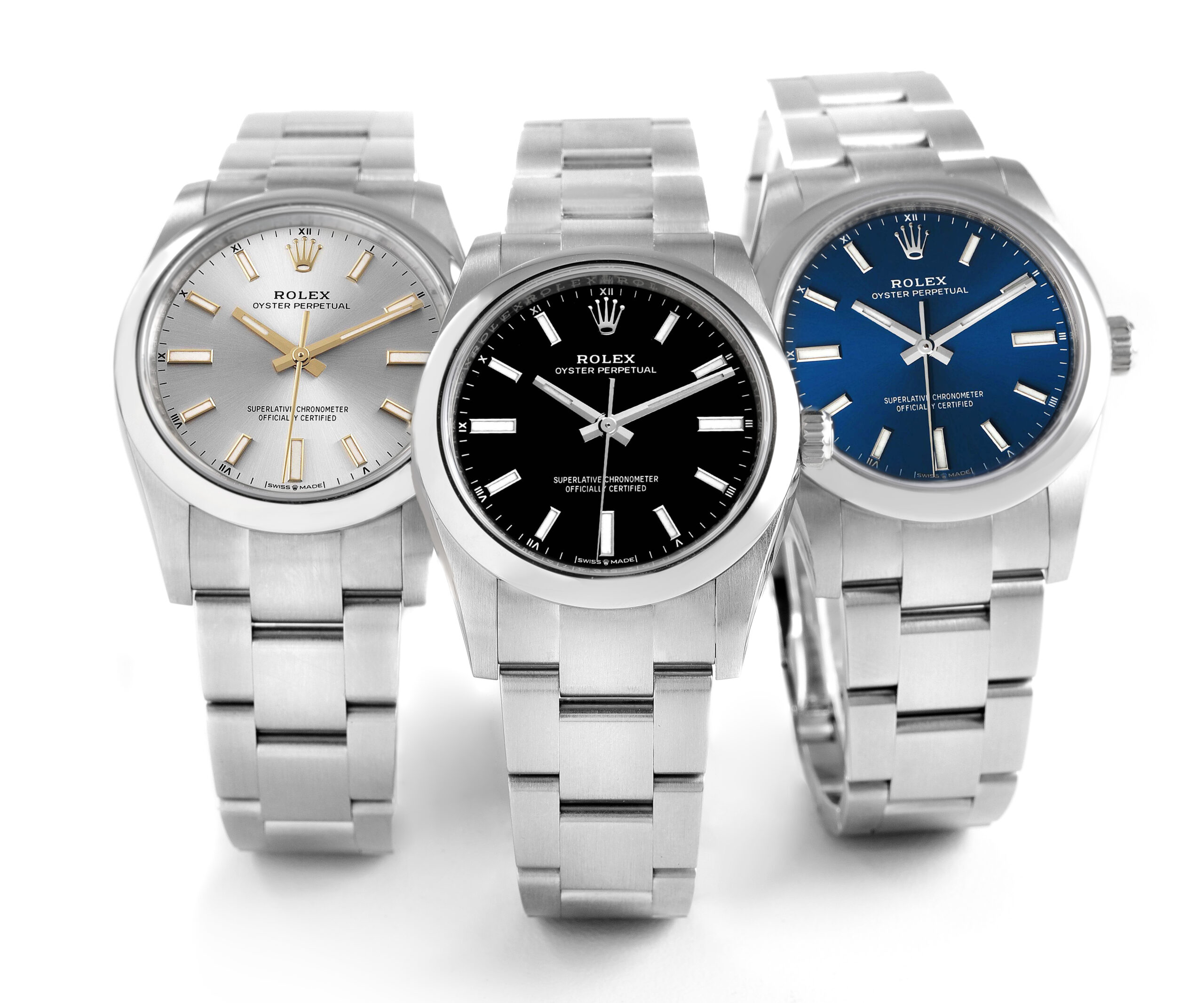 A lineup of affordable, entry-level Rolex watches: The Oyster Perpetual 34mm shown in three different dial colors on a white background.