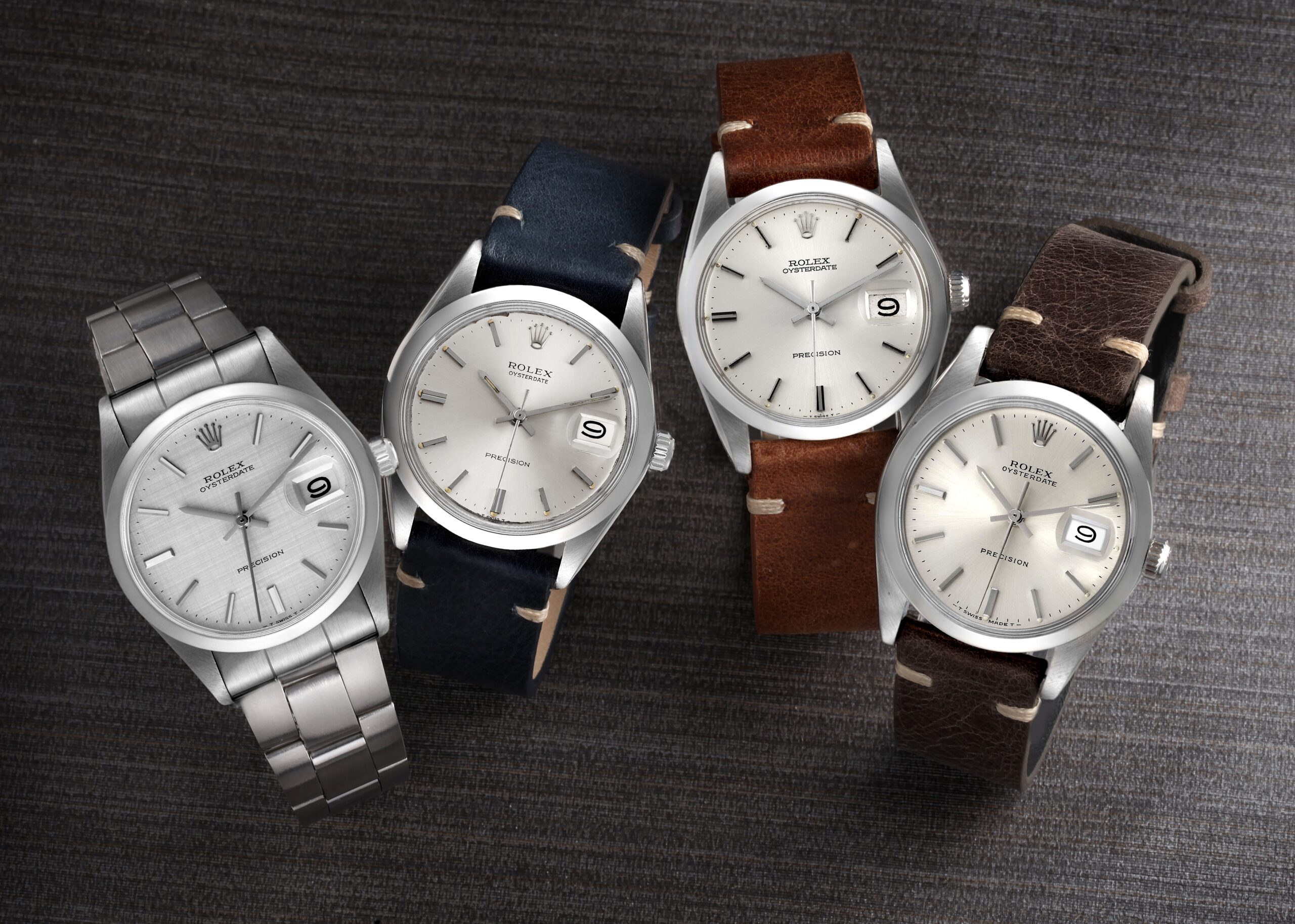 Four Rolex OysterDate 34mm watches with champagne dials, two on leather straps and two on steel bracelets.