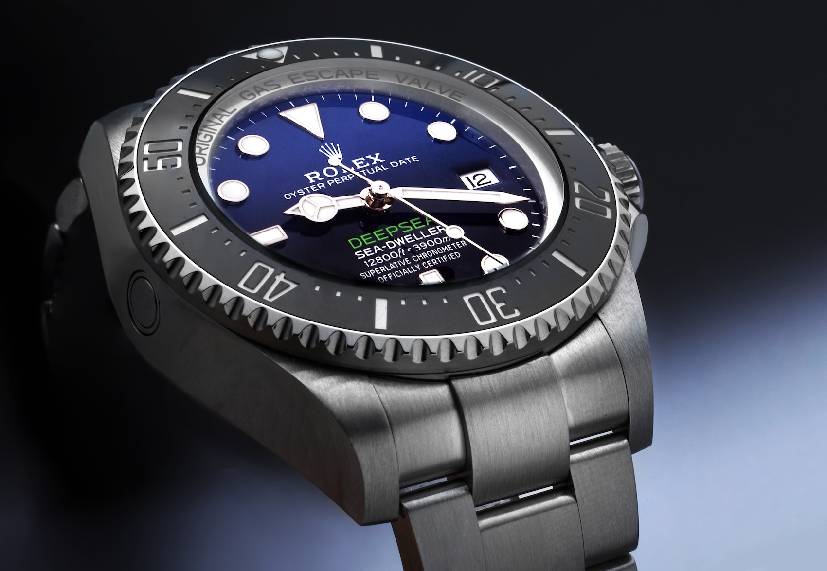 An angled close-up of the Rolex Sea-Dweller Deepsea "James Cameron" watch, showing its thick steel case and gradient D-Blue dial.