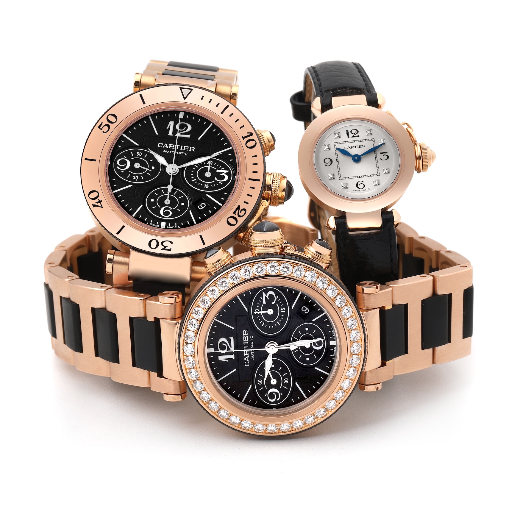 A product photo of three rose gold Cartier Pasha watches on a clean white background. The group includes a diamond bezel Pasha Seatimer, a standard Pasha Seatimer, and a Pasha 27 ladies' watch.