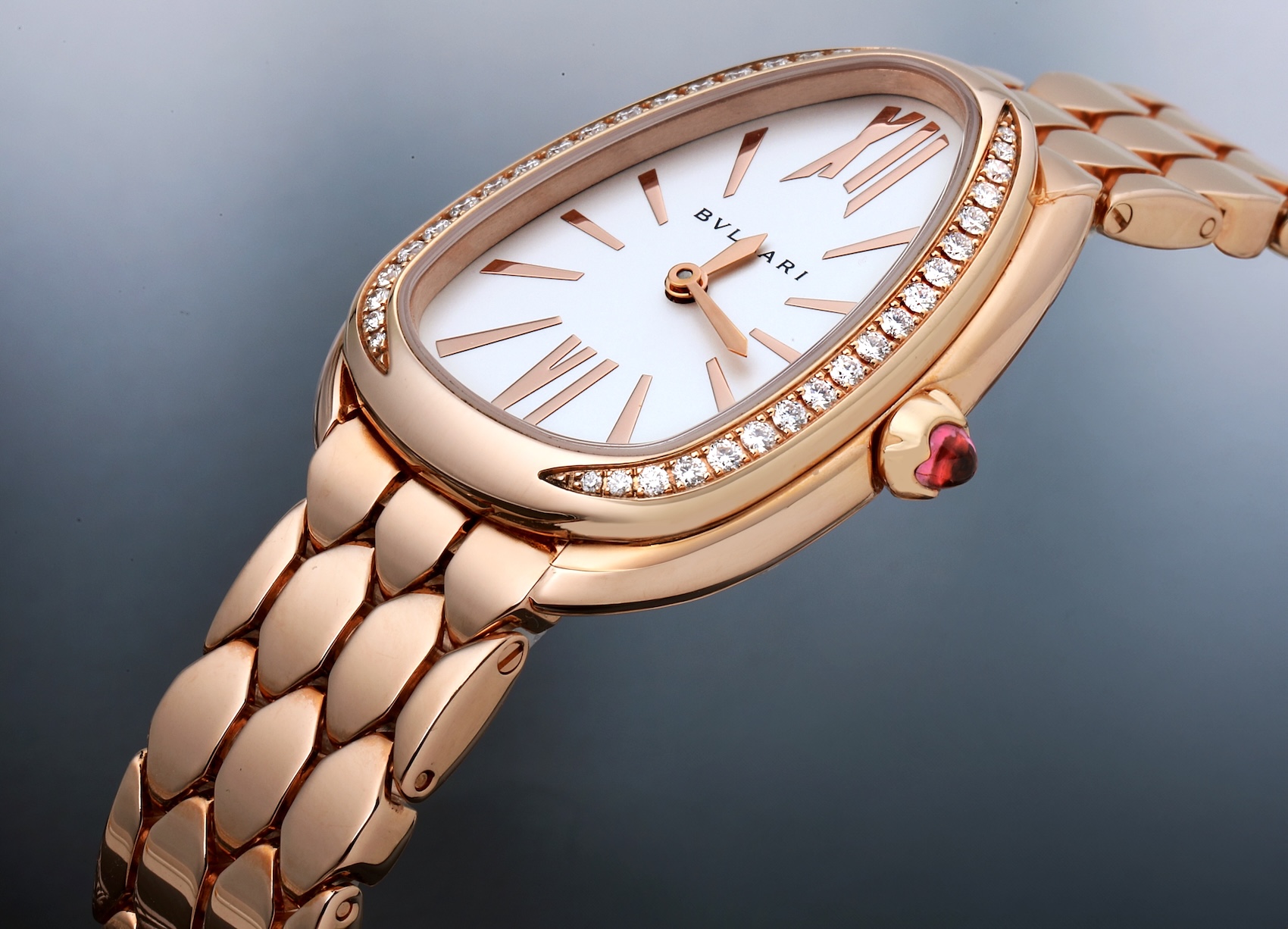 Side profile macro shot of Bvlgari Serpenti Seduttori showing the depth of the diamond bezel and polished rose gold finish.