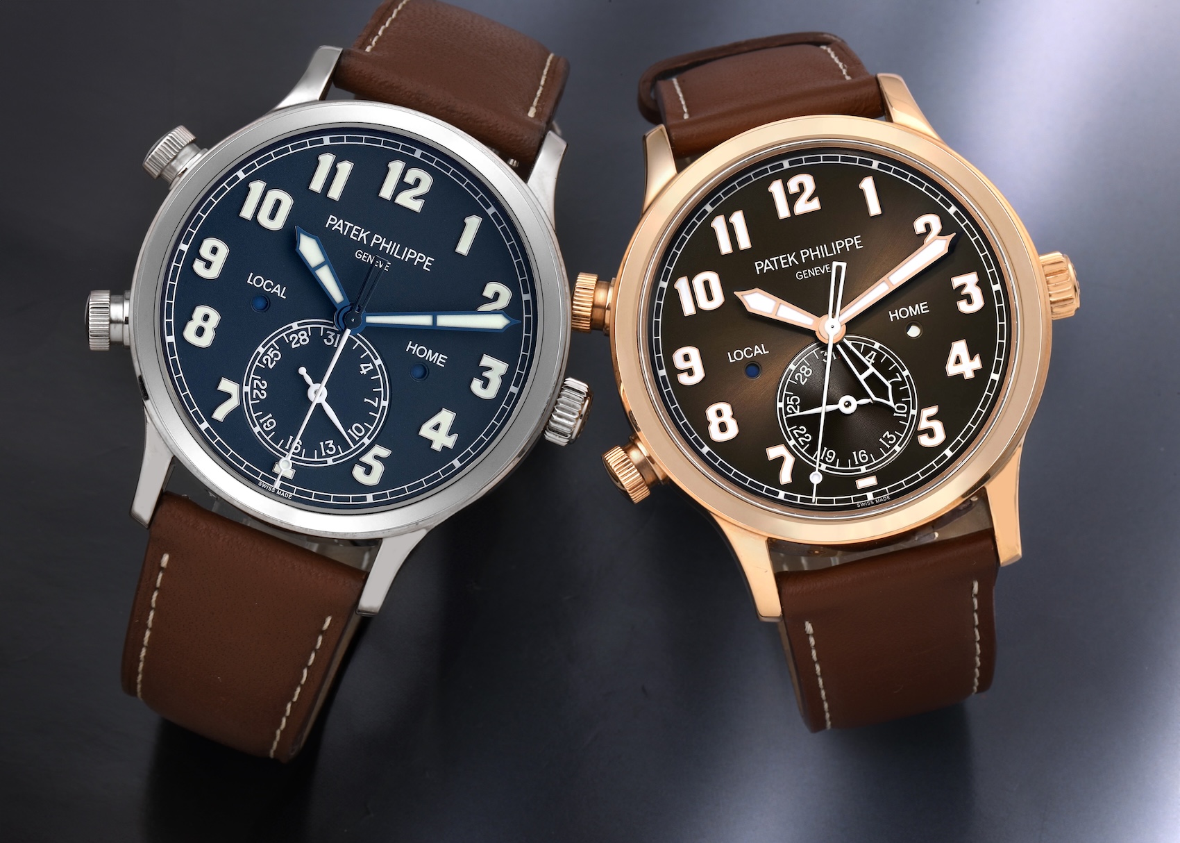 A side-by-side comparison of the Patek Philippe Calatrava Pilot Travel Time 5524G (white gold, blue dial) and the smaller 7234R (rose gold, brown dial).