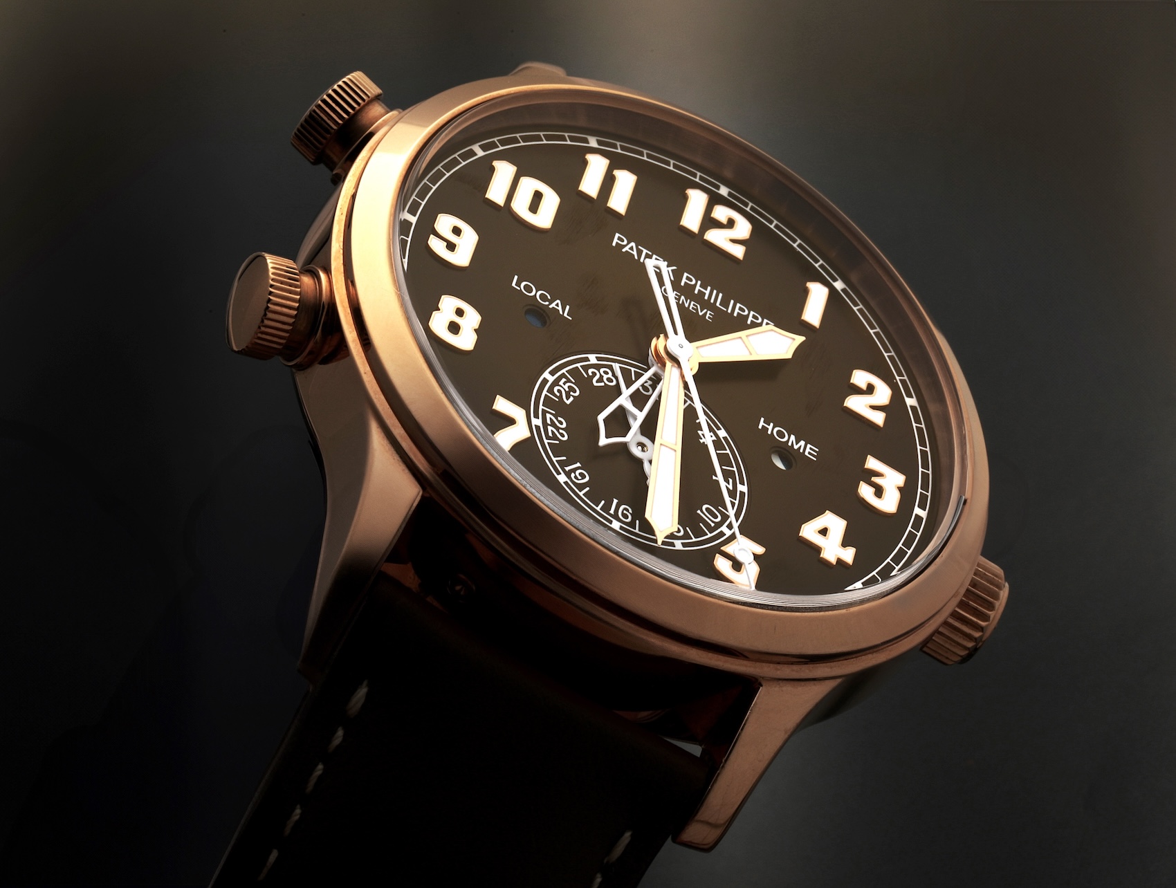 An angled profile shot of the Patek Philippe Calatrava Pilot Travel Time 7234R in rose gold, highlighting its warm brown dial and polished case.