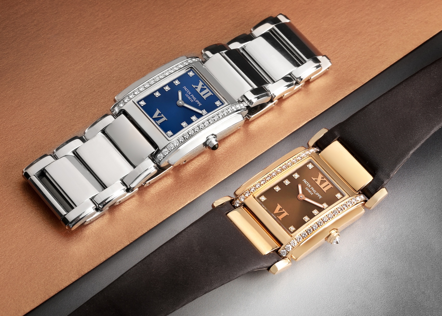 Two Patek Philippe Twenty~4 ref 4910 ladies' watches. One model is stainless steel with a blue dial and diamond-set case, while the other is in rose gold with a brown dial, diamond-set case, and a satin strap.