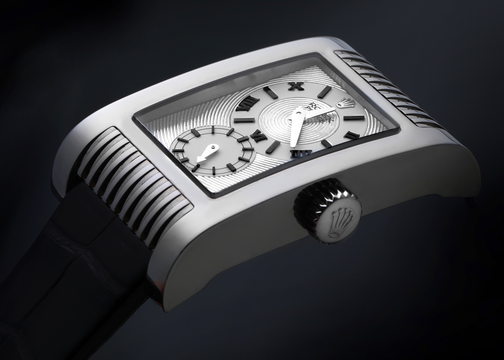 A close-up of the rectangular Rolex Cellini Prince in 18k white gold, featuring an Art Deco-style silver dial with separate subdials for hours/minutes and seconds.