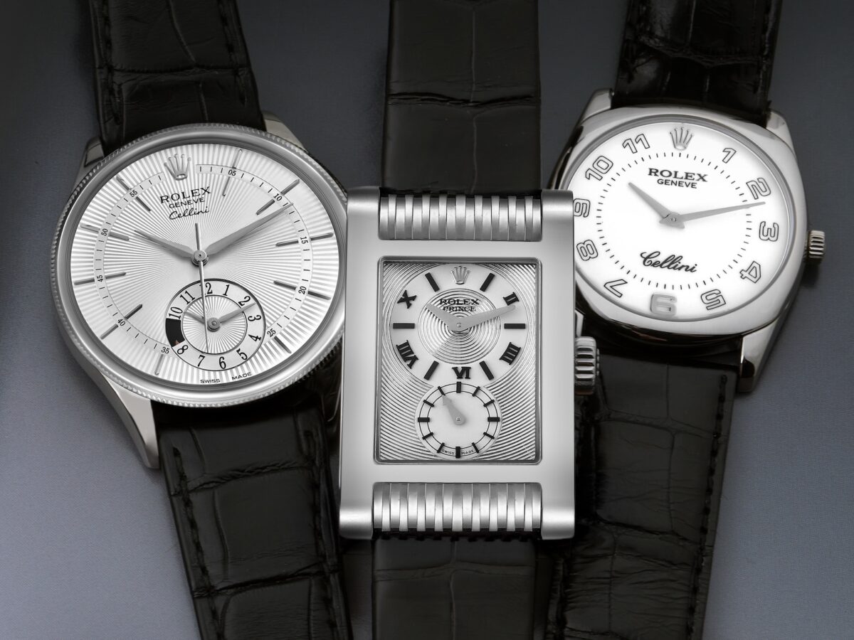 A collection of three Rolex Cellini dress watches in white gold with black leather straps, shown side-by-side: a Cellini Date, a rectangular Cellini Prince, and a cushion-cased Cellini Danaos.