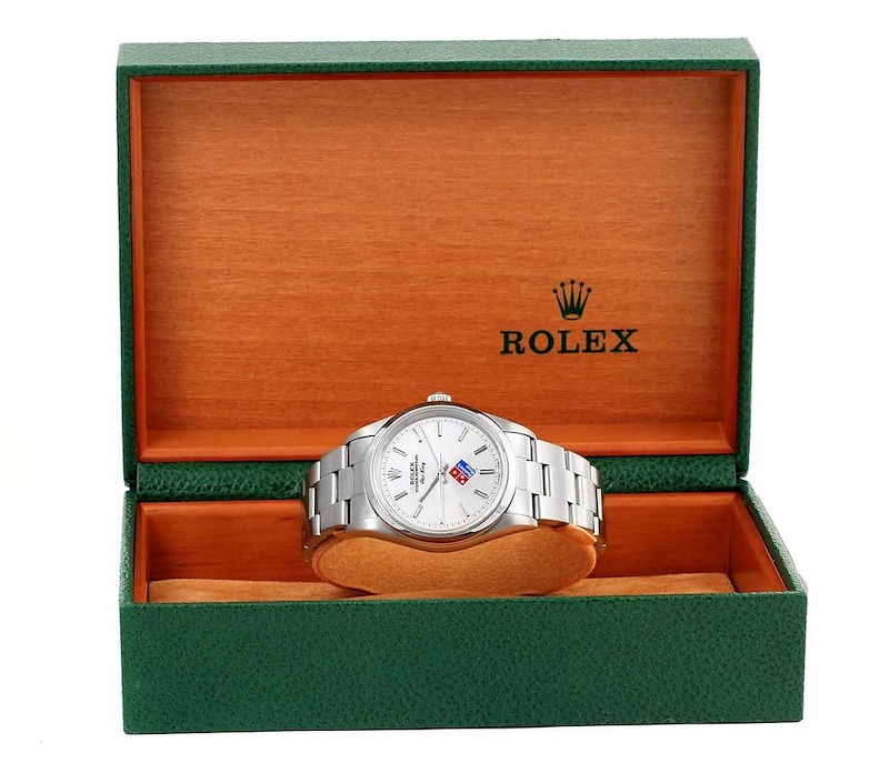 Rolex Air-King Ref. 14000 inside green presentation box featuring the Domino's Pizza logo printed on the dial.