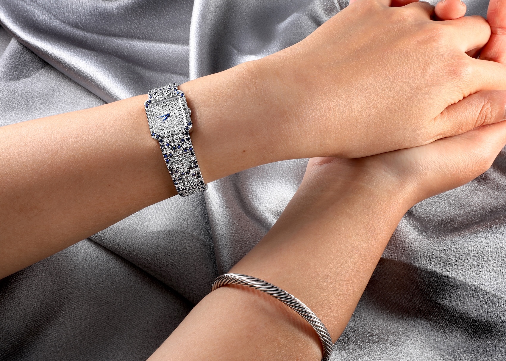 Piaget Protocole Exceptional 22mm ladies watch in white gold, featuring a full diamond pave setting and sapphire accents on the wrist.