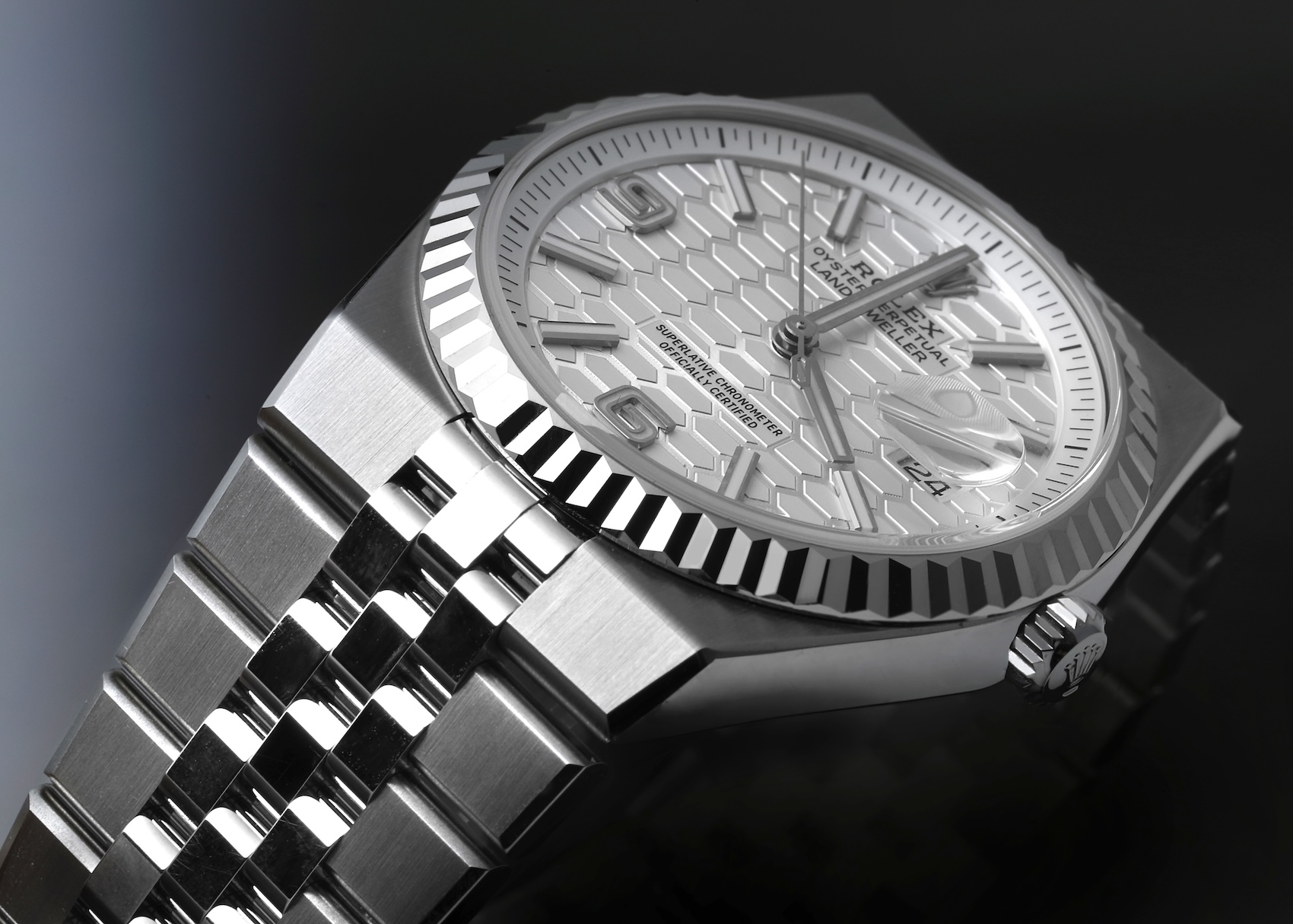 Rolex Land-Dweller watch in steel and white gold with a silver Saros dial, matching the Cloud Dancer trend.