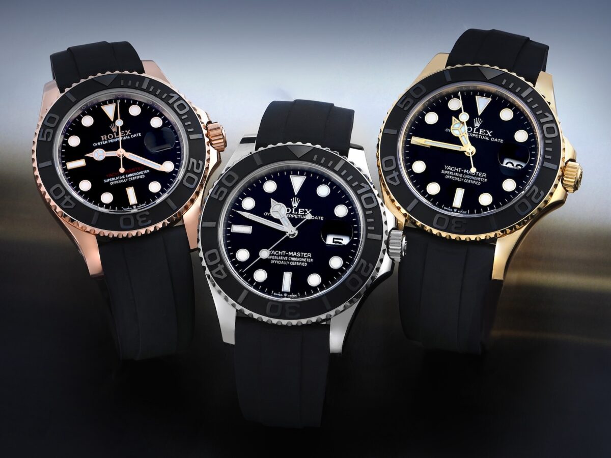 A group shot of the Rolex Yacht-Master Oysterflex lineup in Everose, White, and Yellow gold, angled to show the polished finishes and dial details.