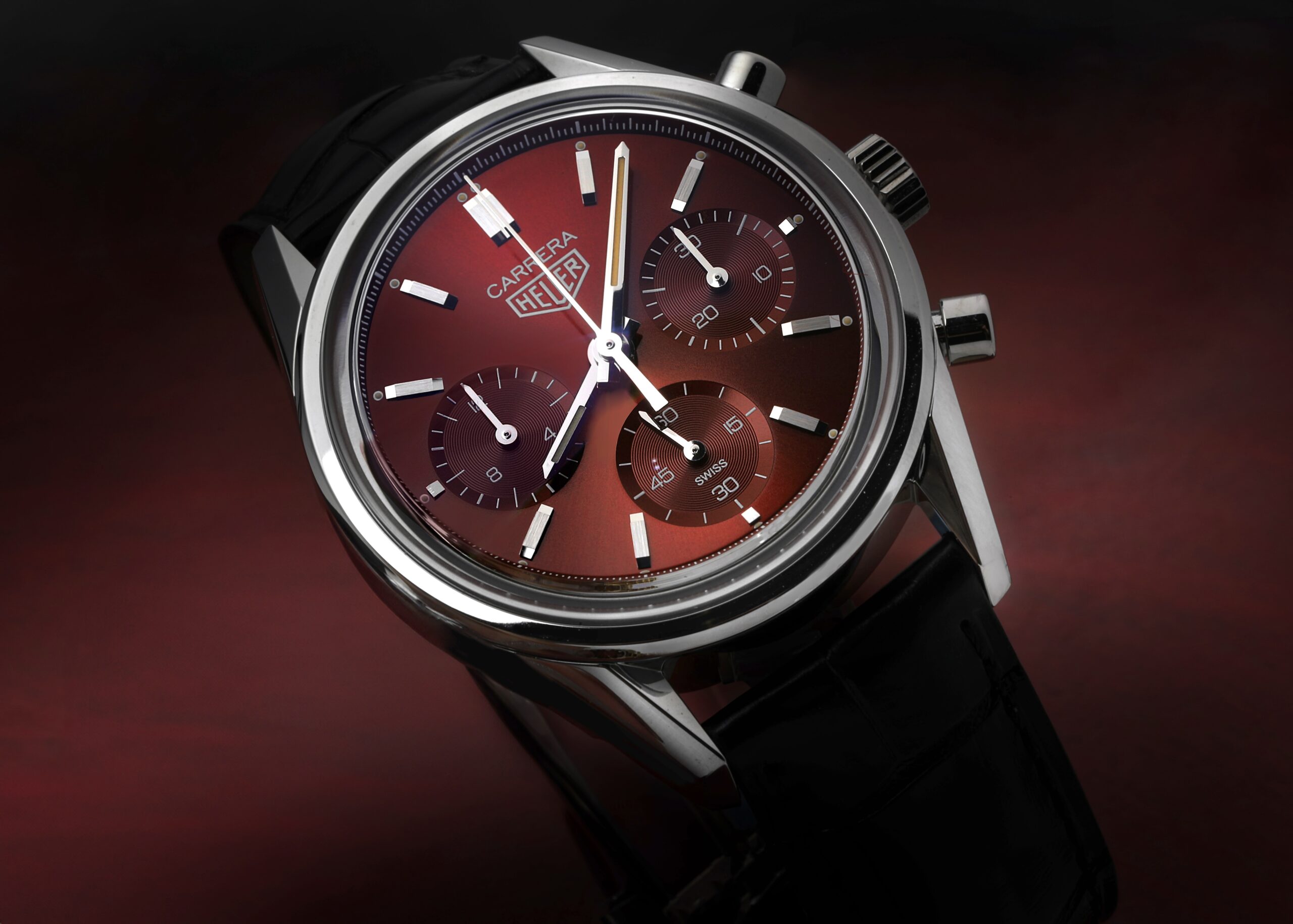 TAG Heuer Carrera Limited Edition chronograph with a deep red sunburst dial, representing the Divine Damson trend among popular colors for 2026.