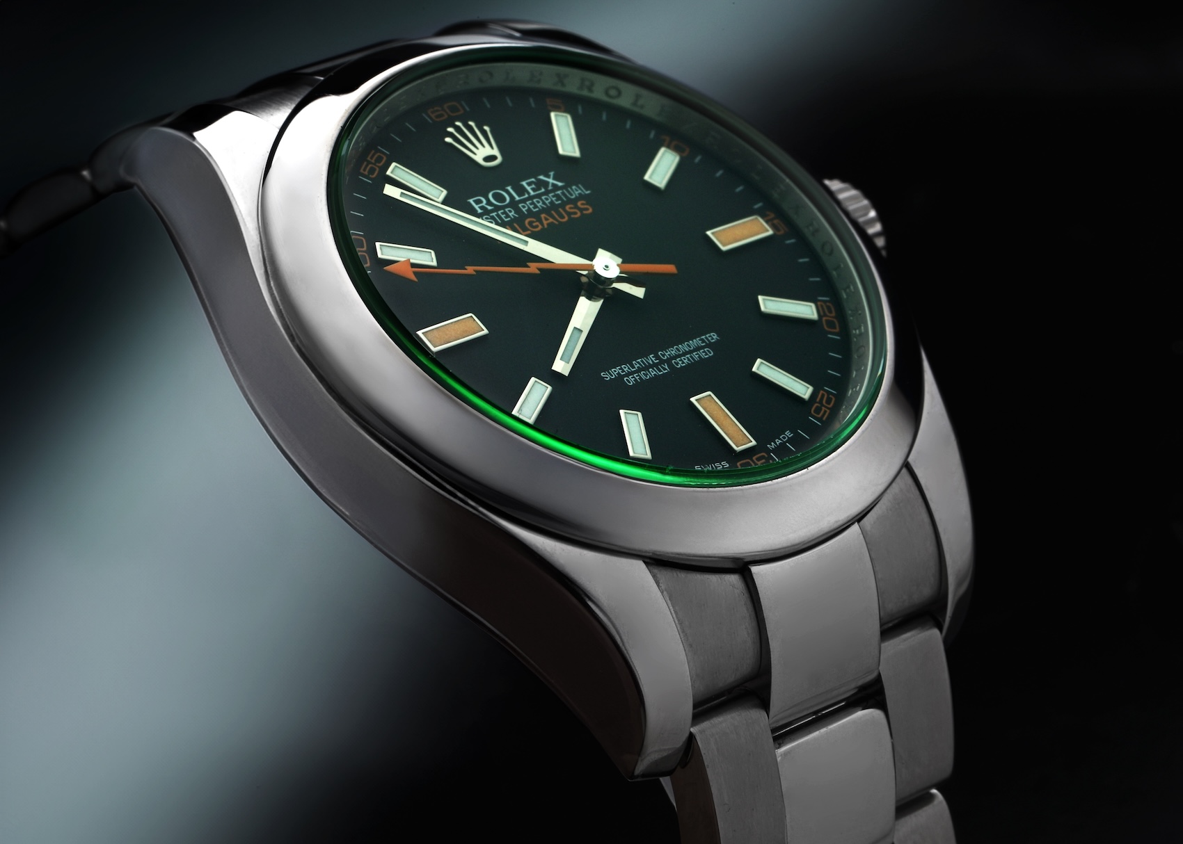 Discontinued Rolex Milgauss Reference 116400 featuring a black dial, clear sapphire crystal, and orange lightning bolt second hand.