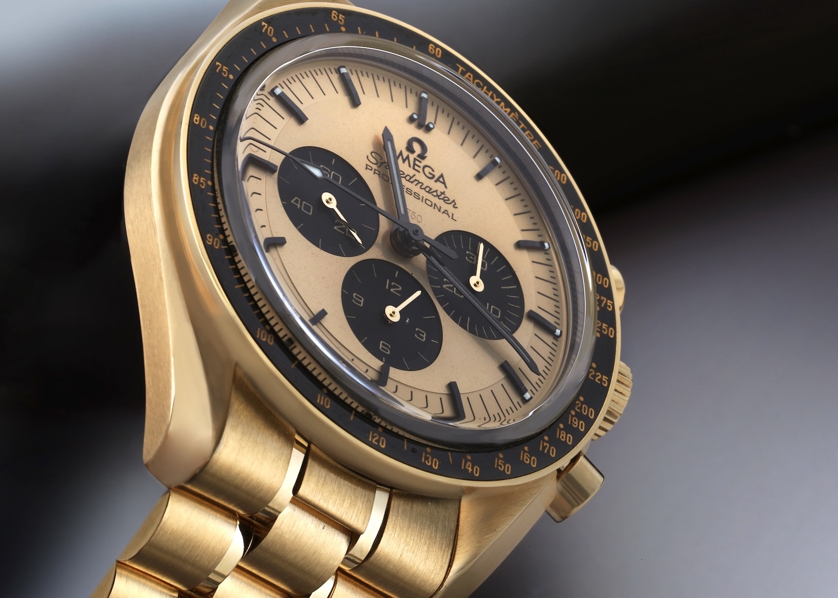 An Omega Speedmaster Moonwatch Professional crafted entirely from 18k Moonshine Gold with a gold dial and black ceramic tachymeter bezel.