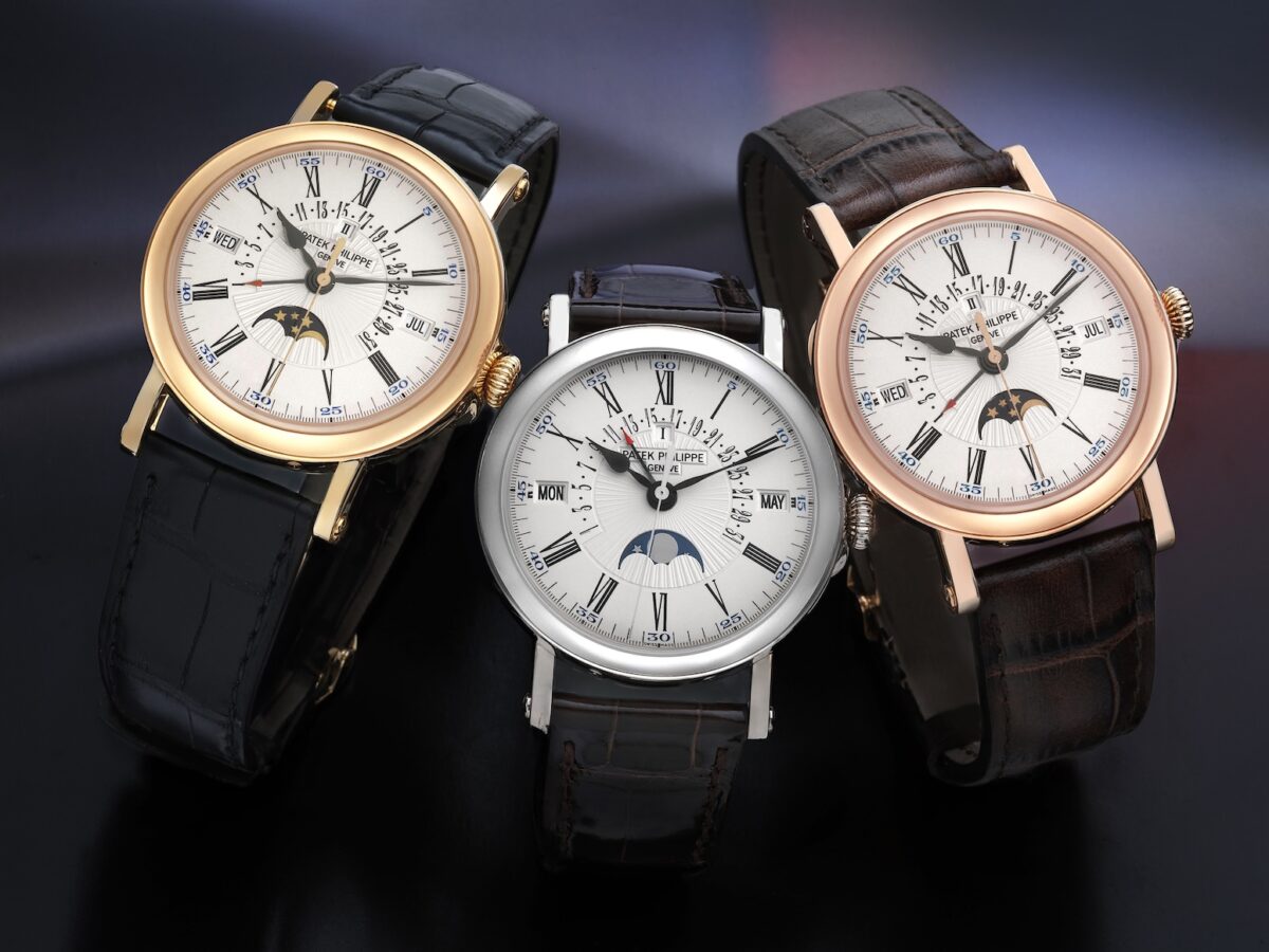 Three Patek Philippe 5159 watches displayed together in yellow gold, white gold, and rose gold.