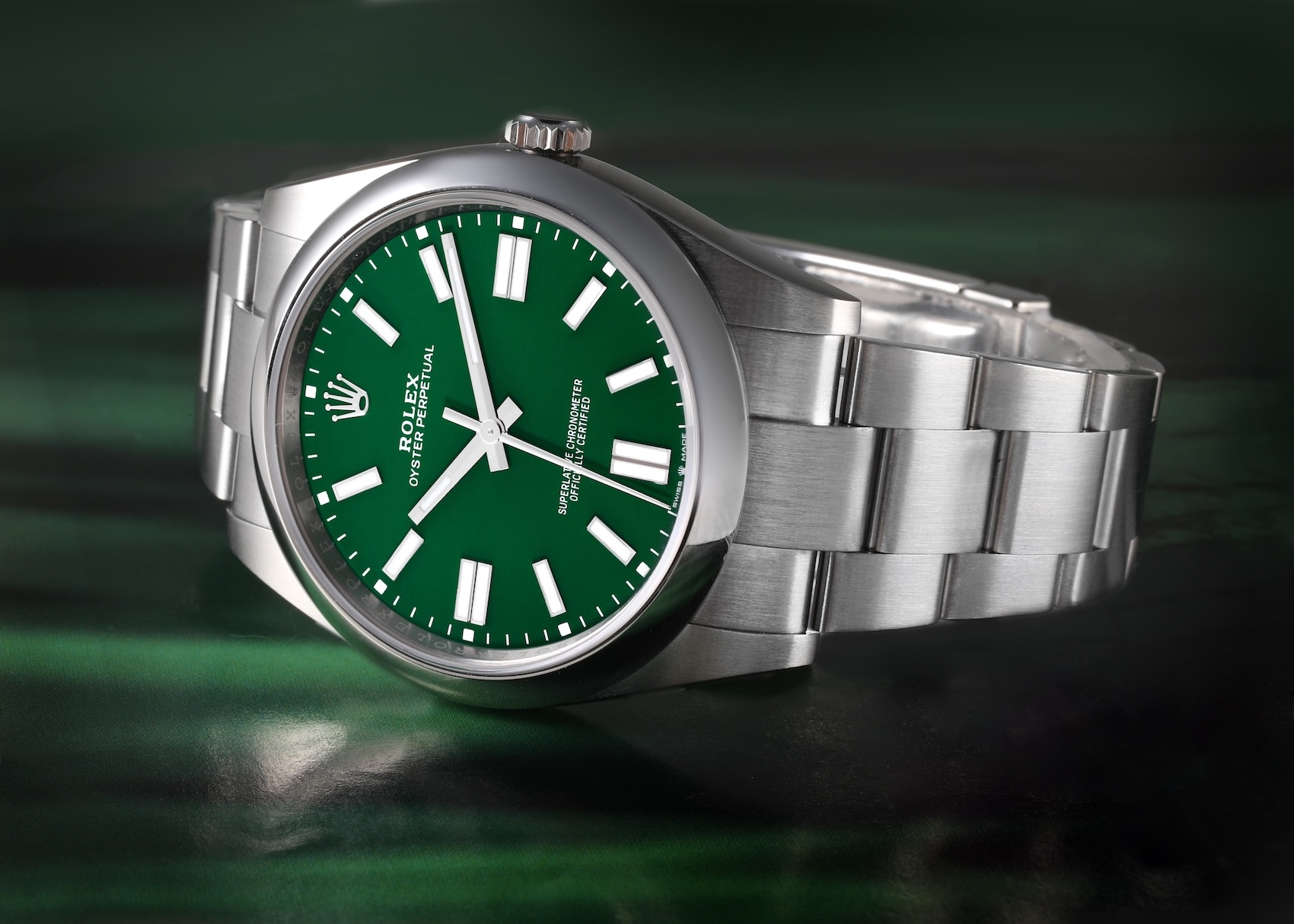 A modern Rolex Oyster Perpetual 36 with a vibrant "Stella-inspired" green dial and brushed steel Oyster bracelet.