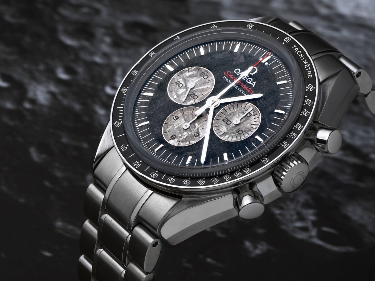 Angled view of the Omega Speedmaster Apollo-Soyuz Limited Edition watch showing the high-contrast meteorite sub-dials against a dark galvanized base dial.