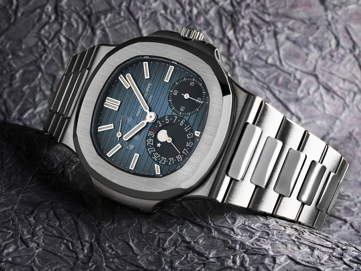 Macro view of the Patek Philippe Nautilus 5712/1A-001 Moonphase in steel, showing the asymmetrical dial layout.