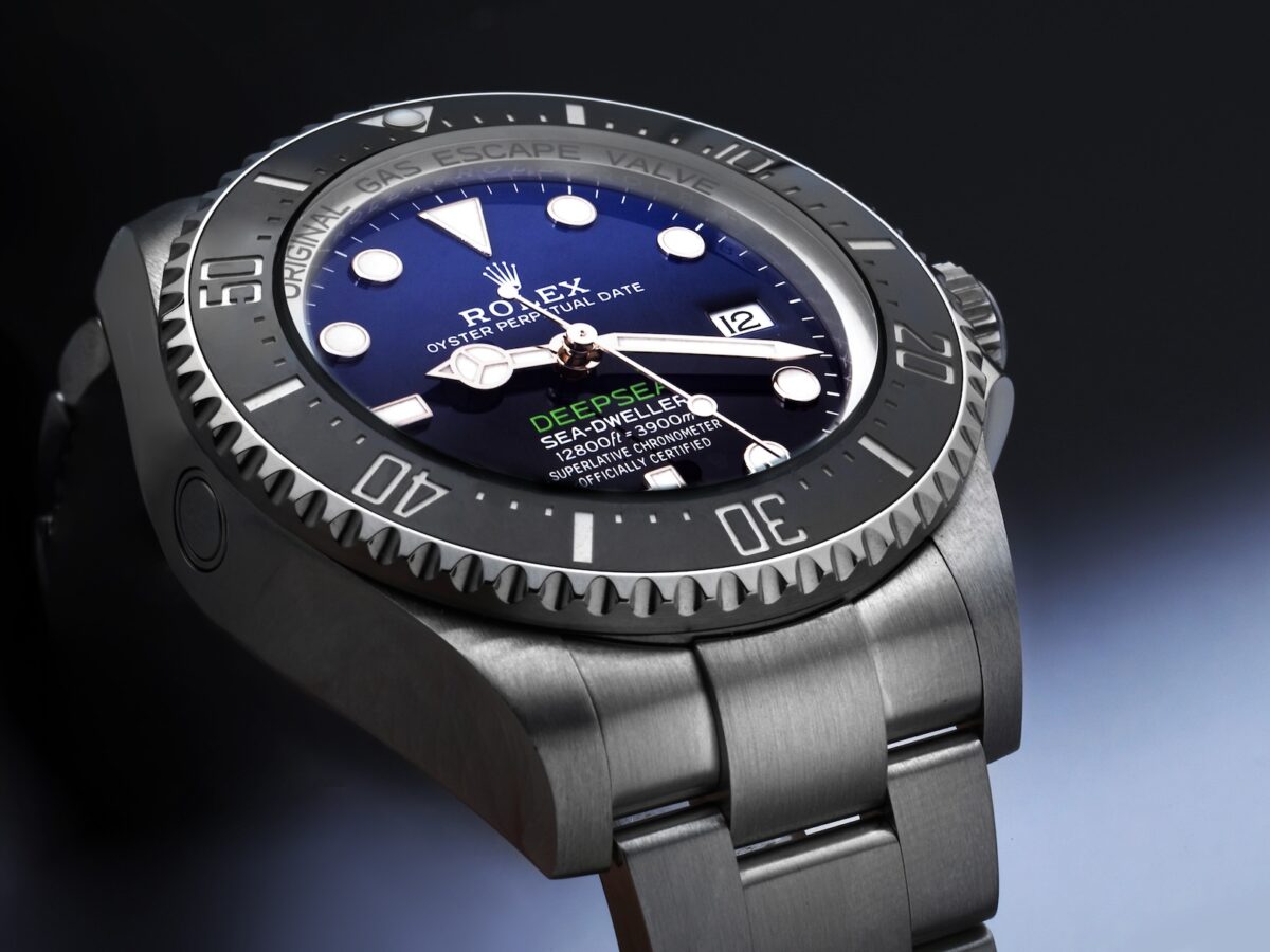 Rolex Deepsea Sea-Dweller 136660 with D-Blue gradient dial and green DEEPSEA text, featuring the Ring Lock System.