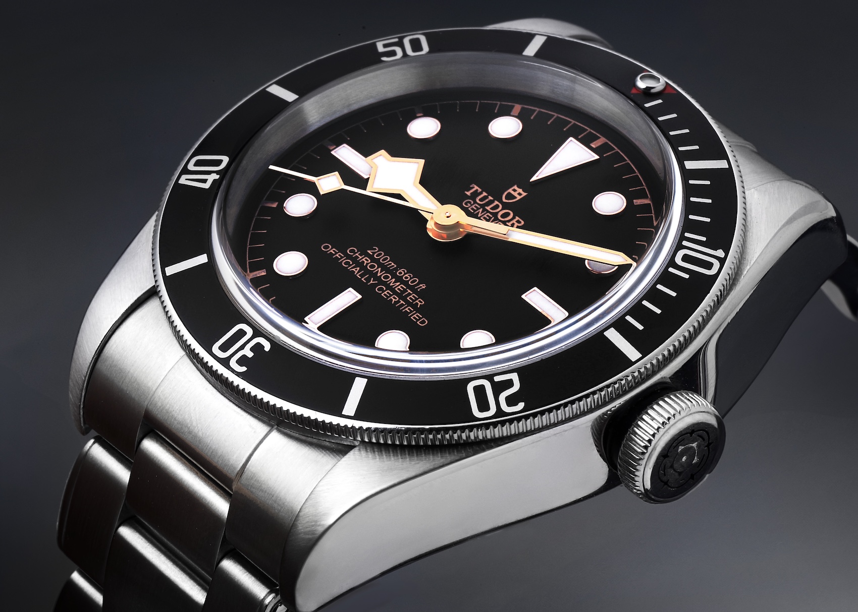 Close up of Tudor Black Bay 58 Gilt dial with snowflake hands on steel bracelet.