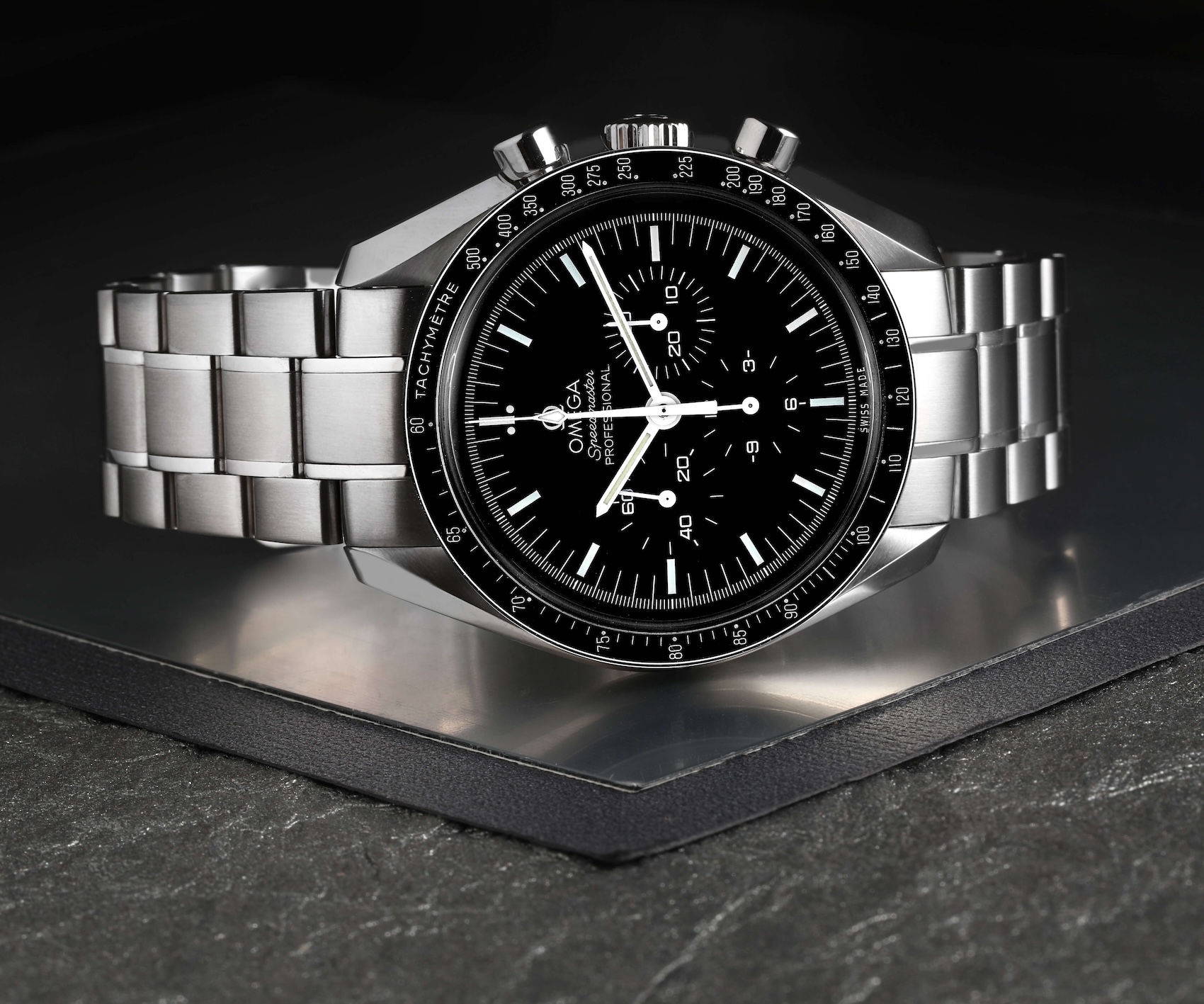 The Omega Speedmaster Professional Moonwatch on a steel bracelet, a testament to Omega's technical pedigree.