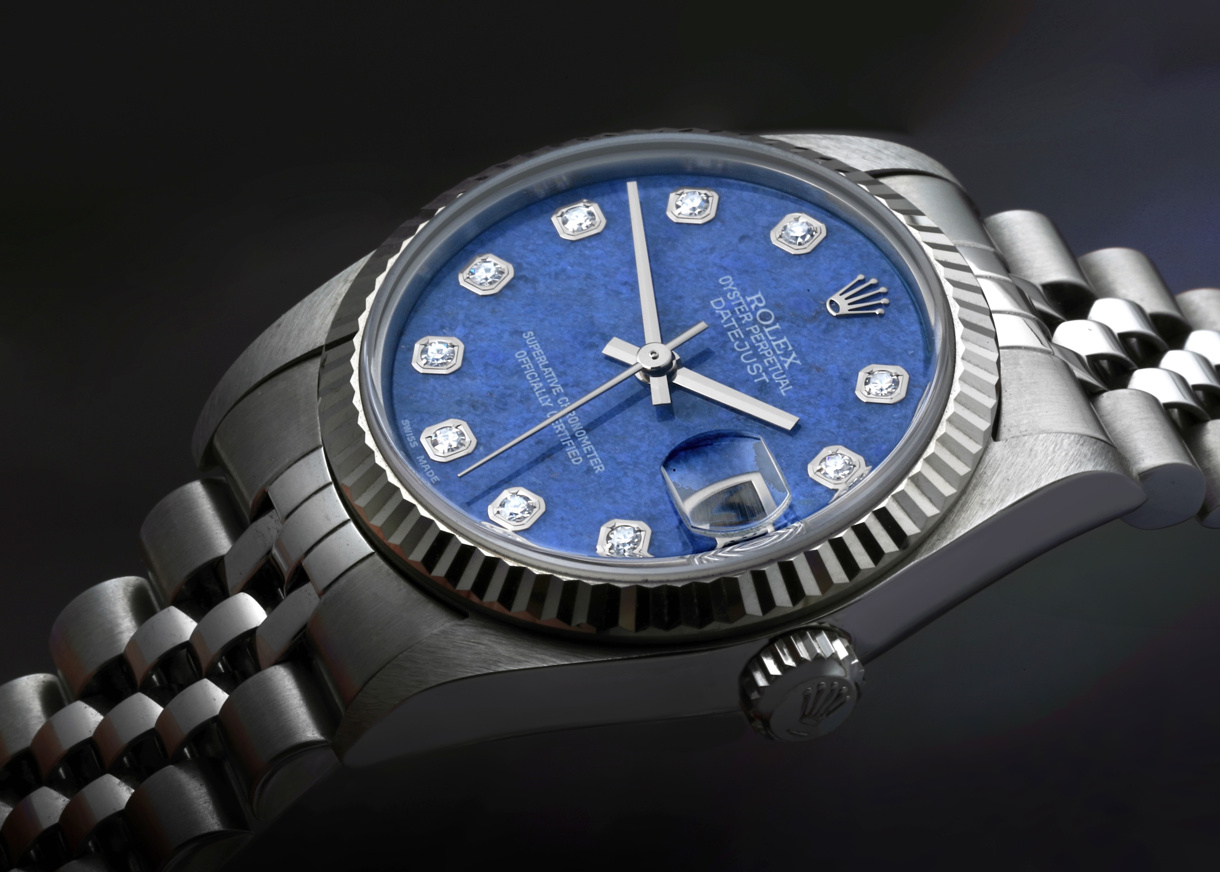 Rolex Datejust midsize with a blue sodalite diamond dial featuring the iconic Cyclops lens over the date aperture.