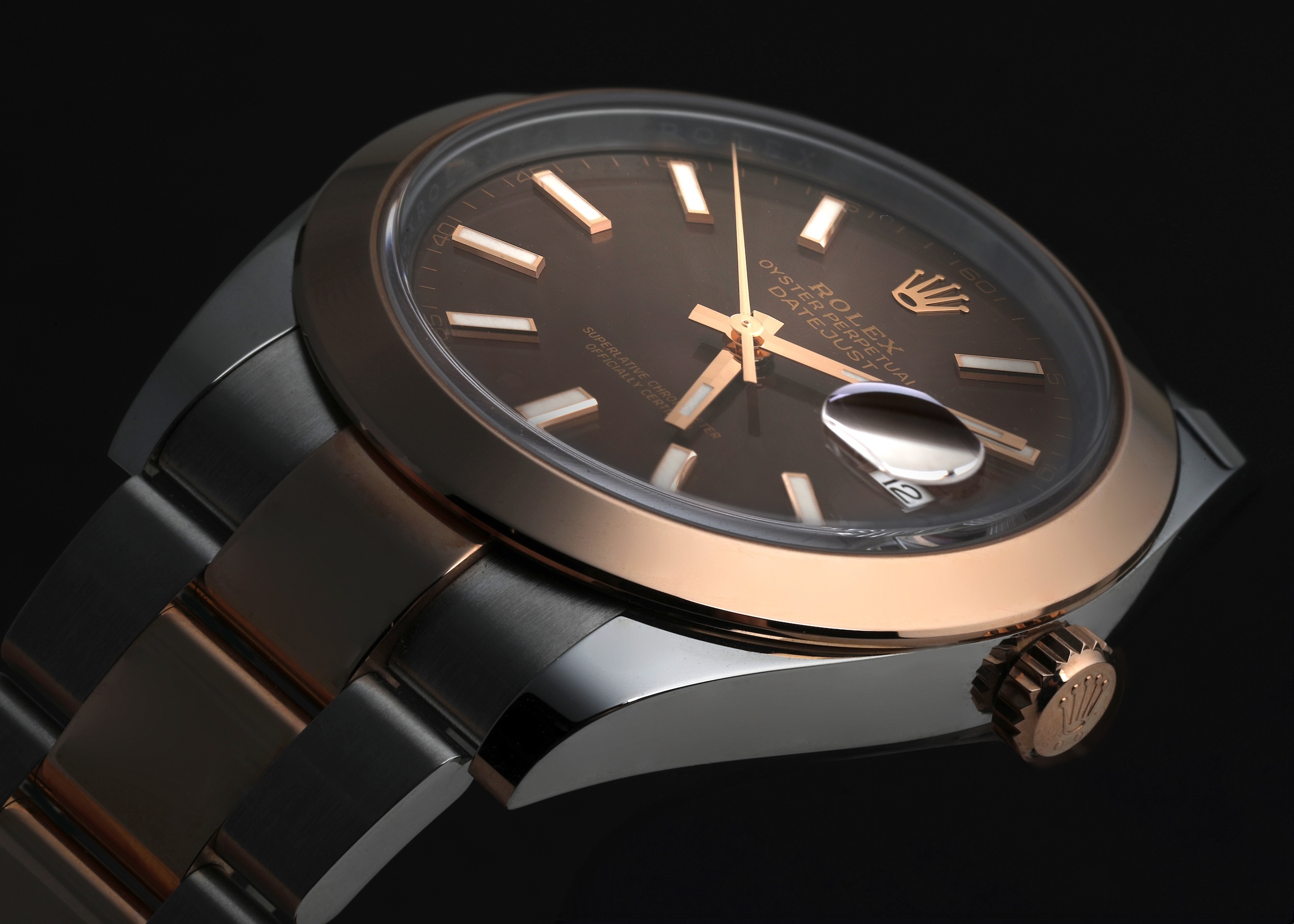 Profile view of a Rolex Datejust 41 showing the sapphire Cyclops lens protruding above the main crystal.