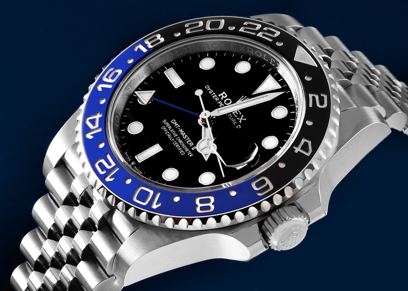  Stainless steel Rolex GMT-Master II Batgirl ref 126710BLNR showing the Triplock crown with three equal dots.