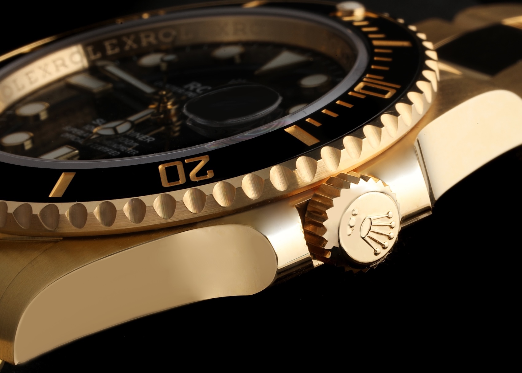 Solid 18k yellow gold Rolex Submariner ref 126618 showing the Triplock winding crown with three equal dots.